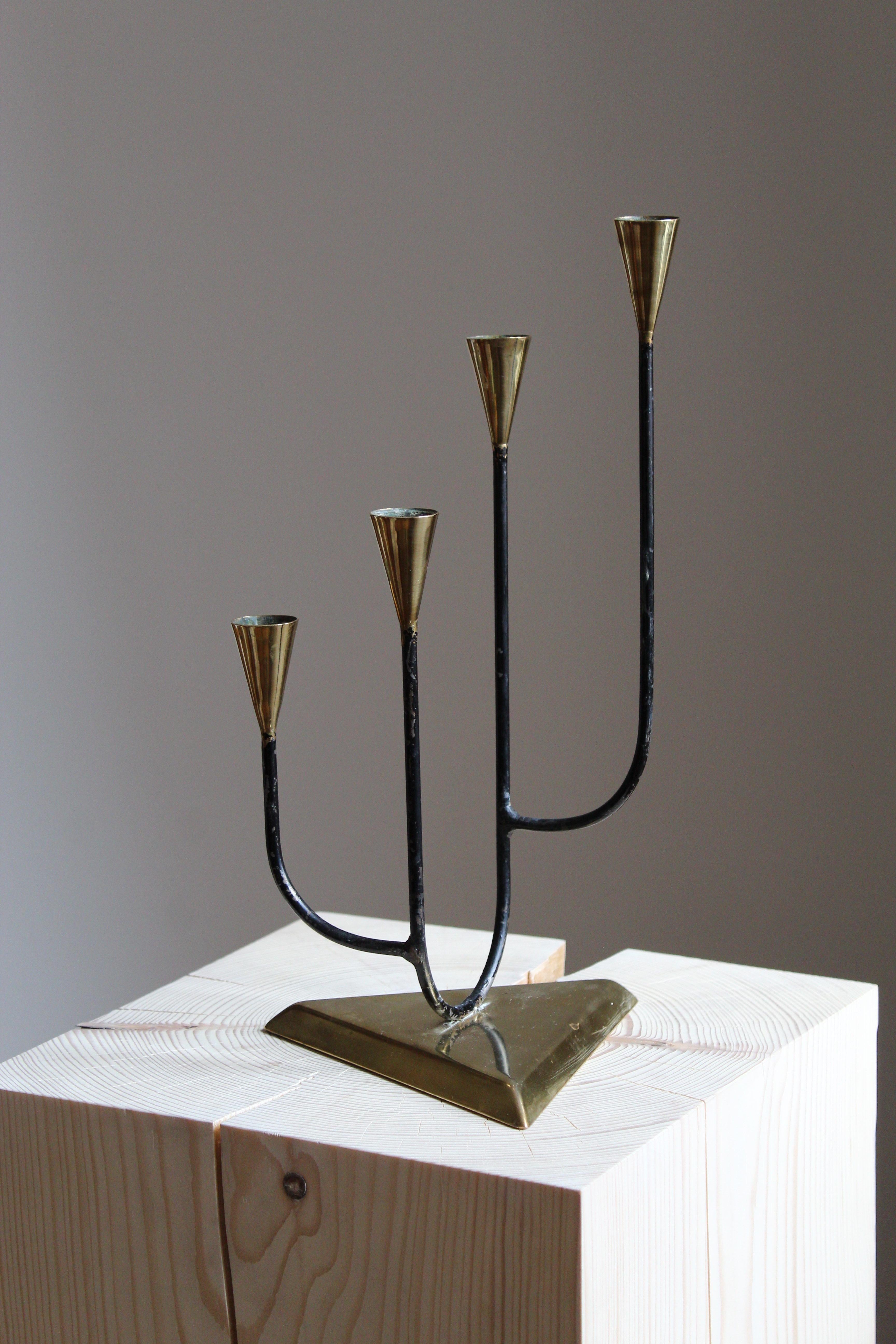 A candelabra, Sweden, 1940s. In brass and painted metal.

Other designers of the period include Piet Hein, Paavo Tynell, Josef Frank, and Jean Royère.

  