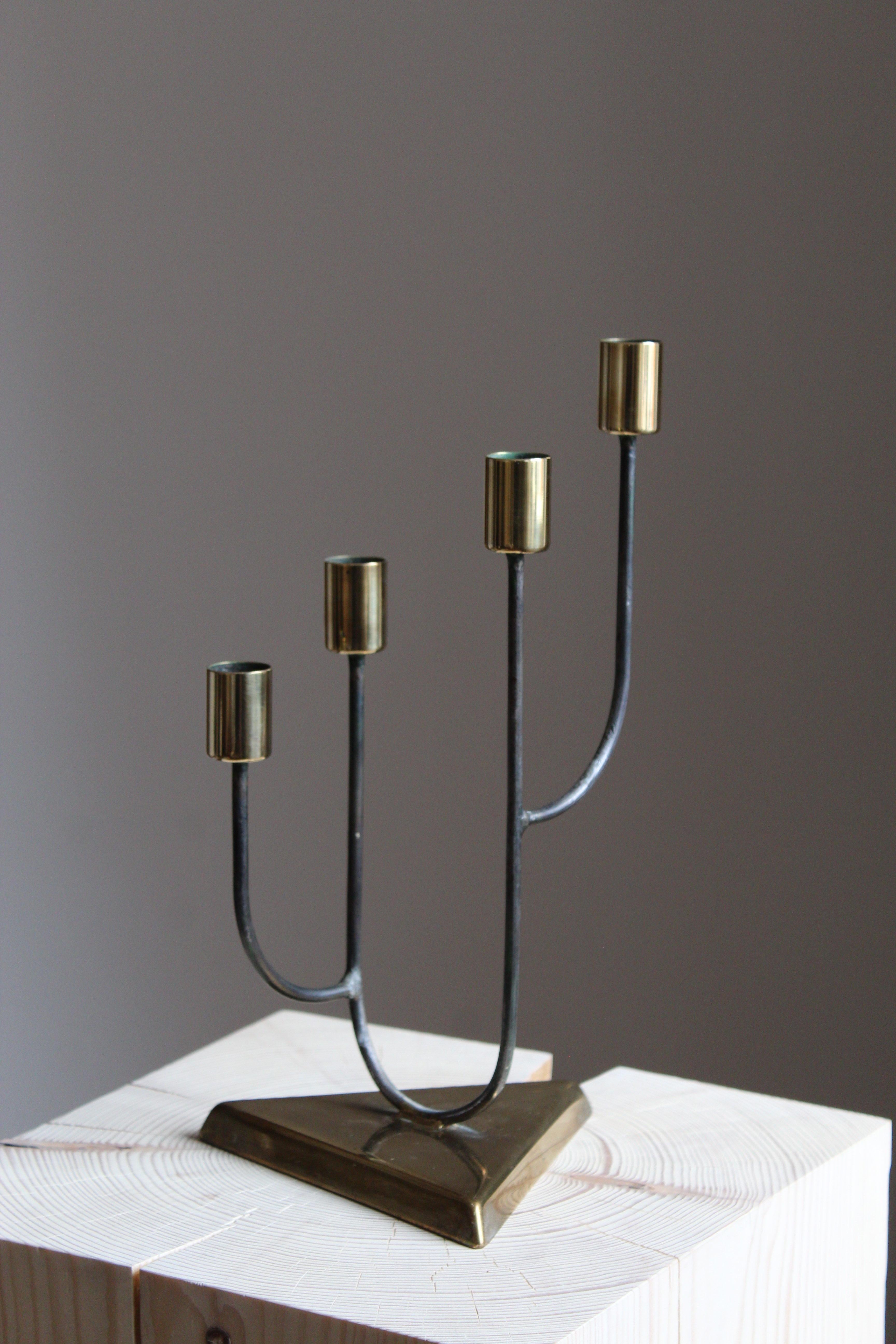 A candelabra, Sweden, 1950s. In brass and painted metal.

Other designers of the period include Piet Hein, Paavo Tynell, Josef Frank, and Jean Royère.

  
