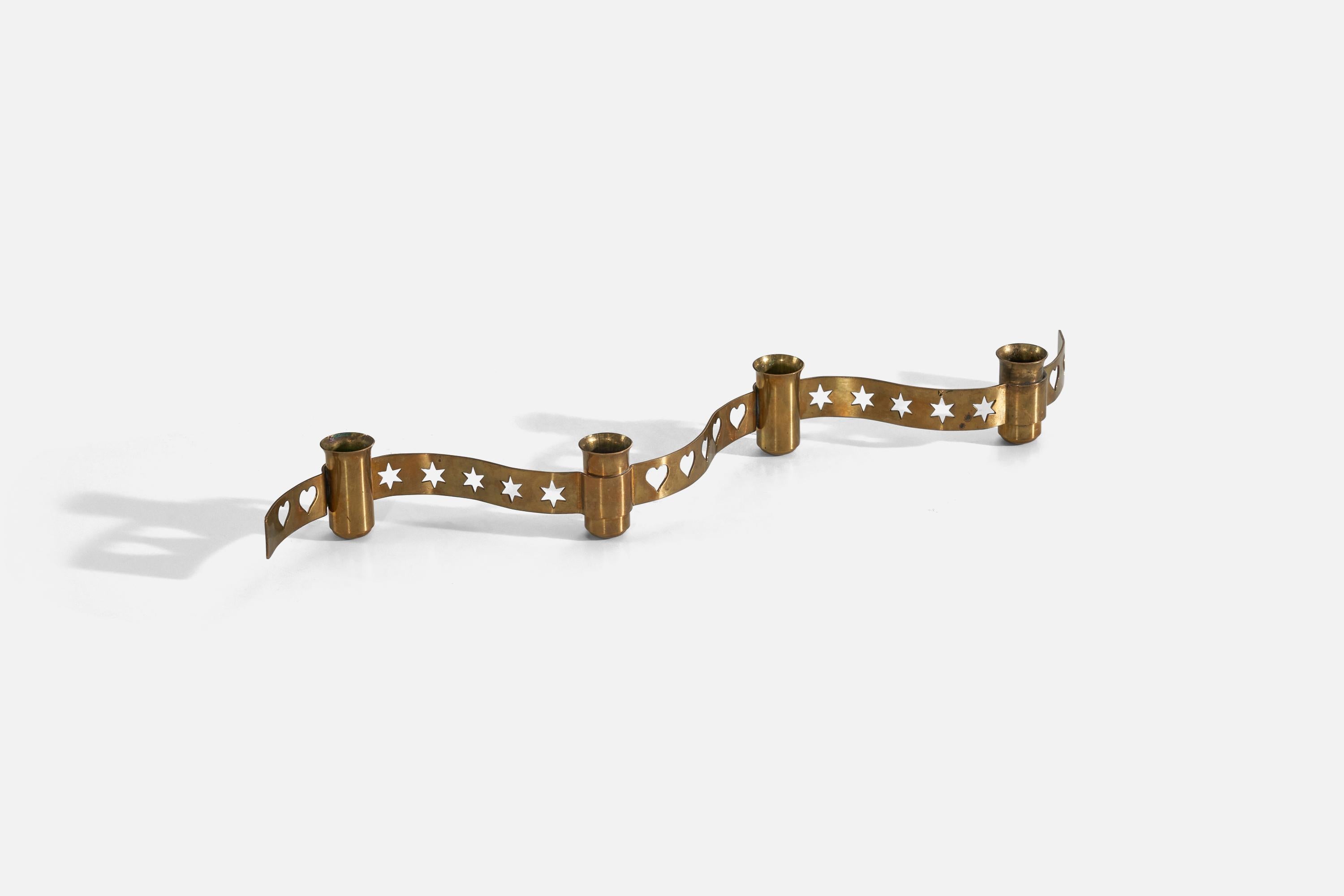 A brass candle holder designed and produced in Sweden, 1940s.