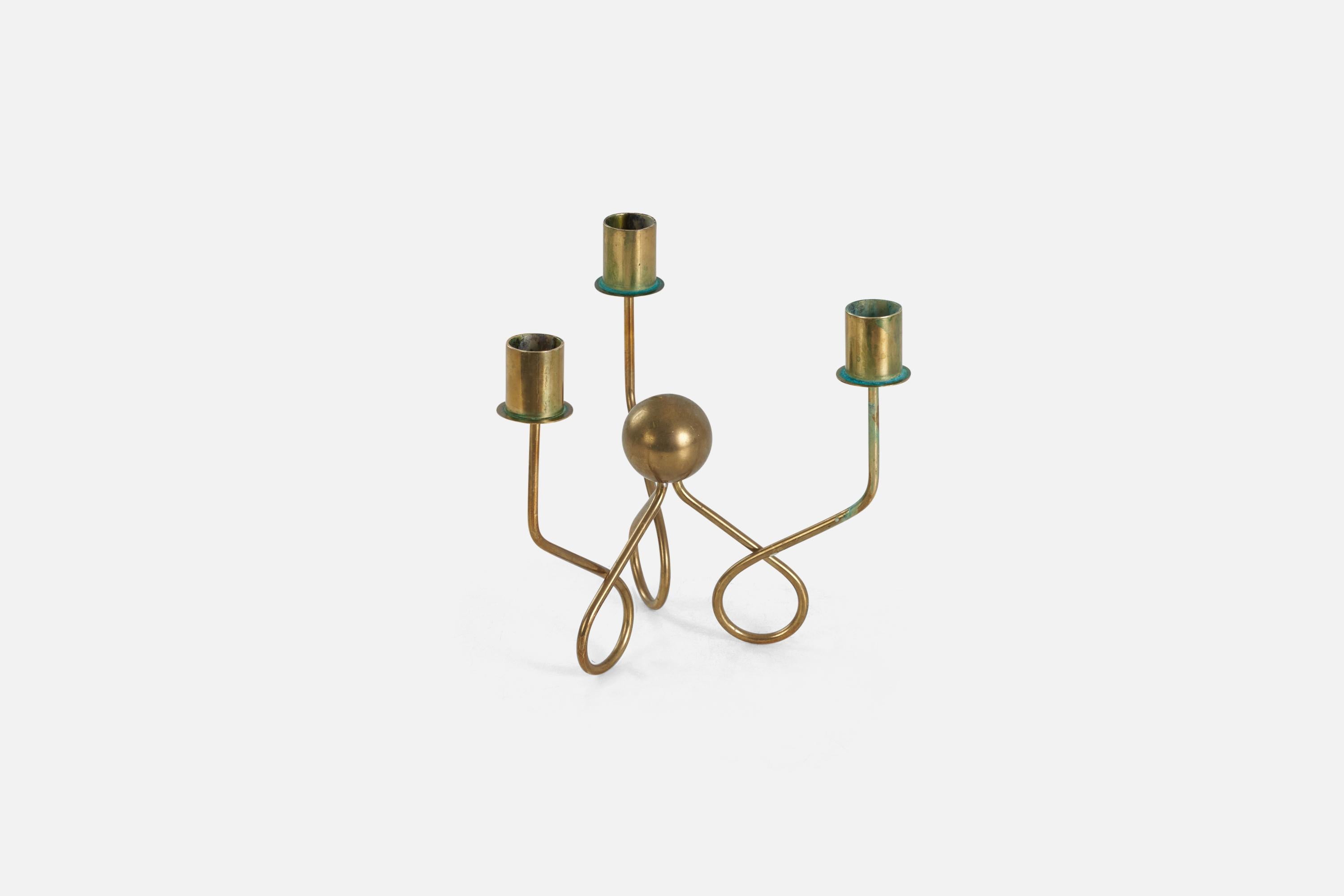 A brass candle holder designed and produced in Sweden, 1940s.