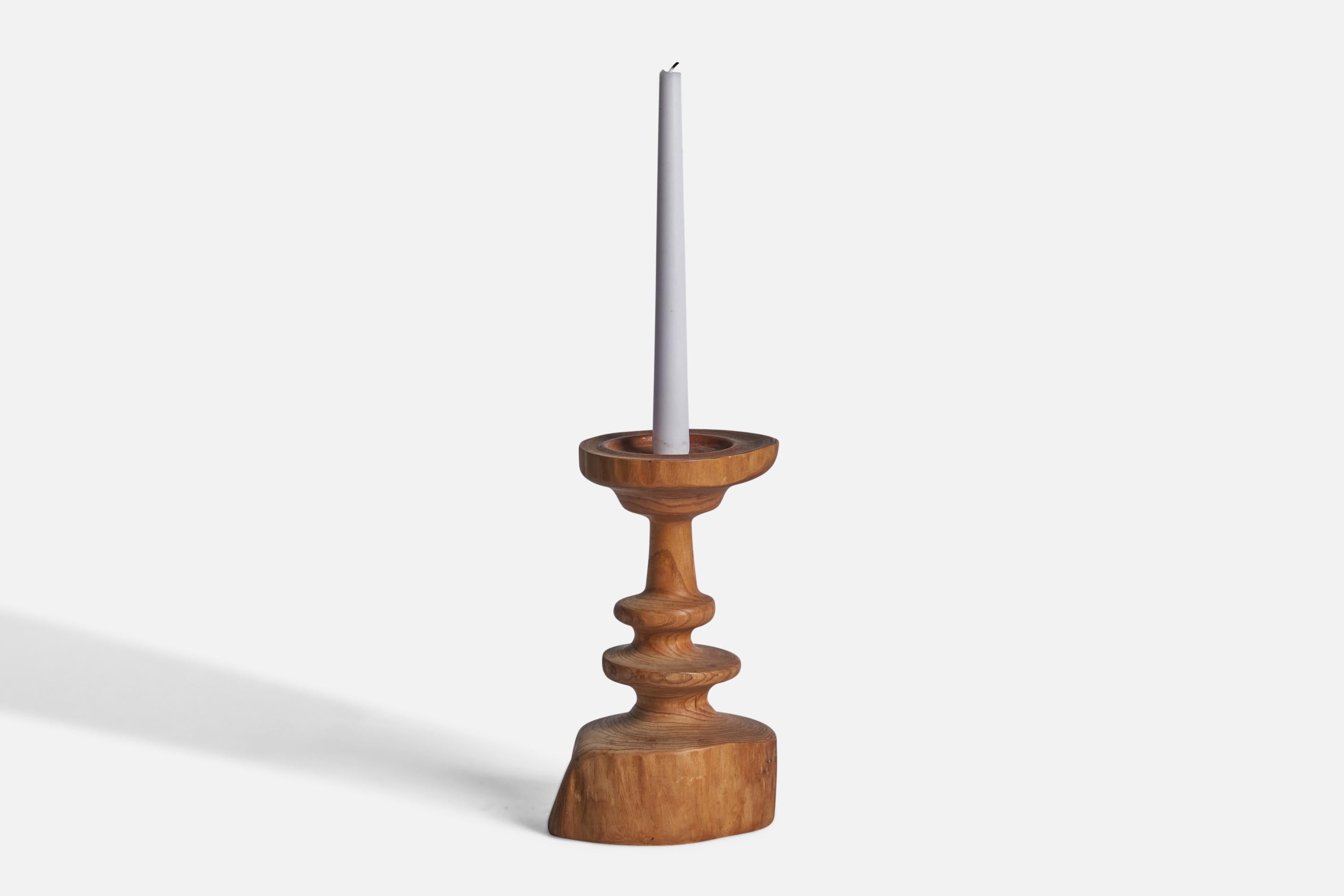 A freeform pine candlestick designed and produced in Sweden, c. 1970s.

Holds 0.75” candle