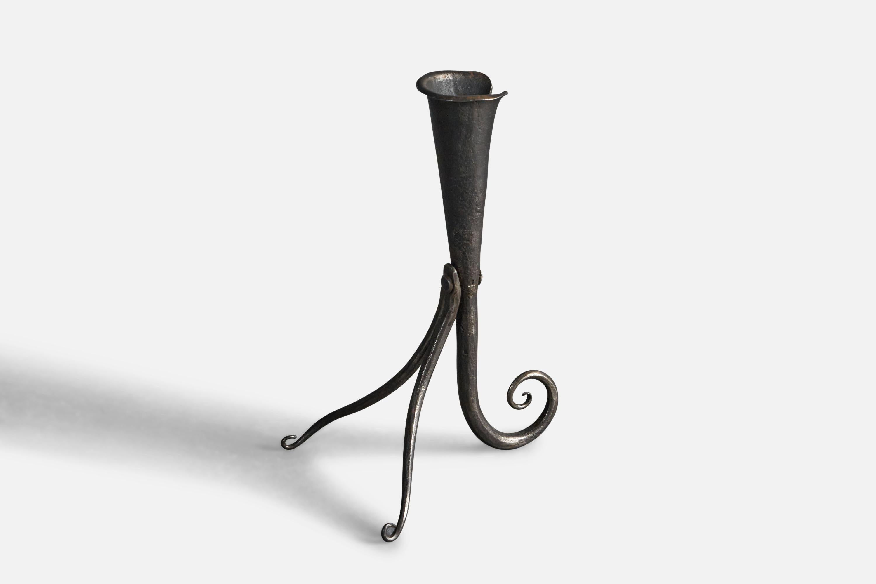A wrought iron candle stick designed and produced in Sweden, 1930s.