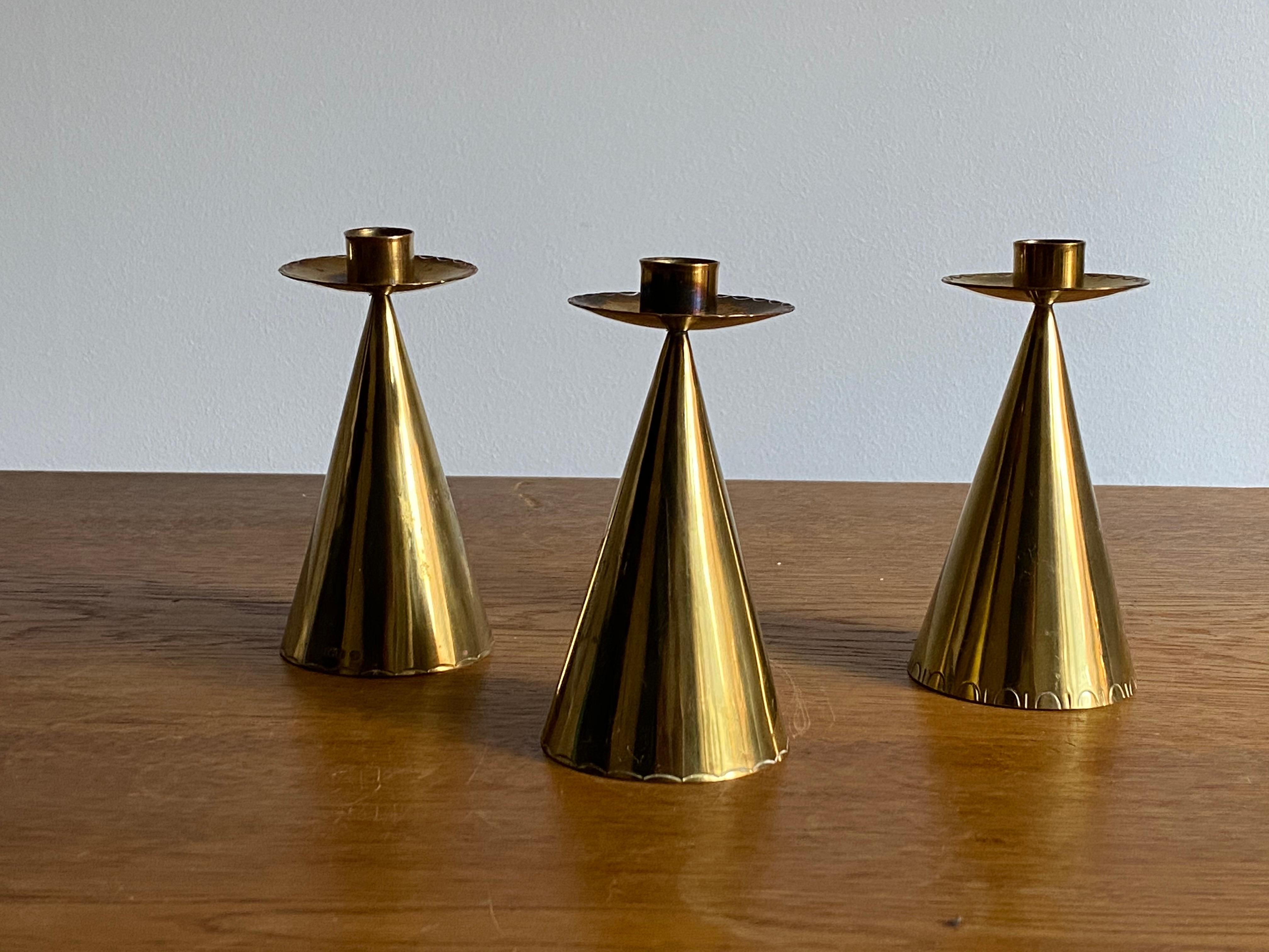 A set of small brass candlesticks. Produced in Sweden, 1950s. Stamped 