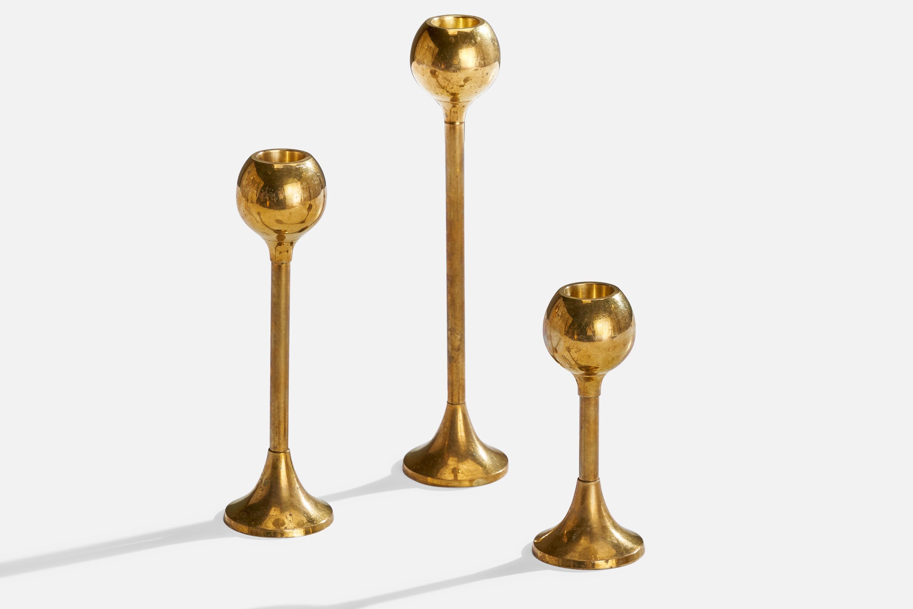 A set of three brass candelsticks designed and produced in Sweden, c. 1950s.

Holds .89