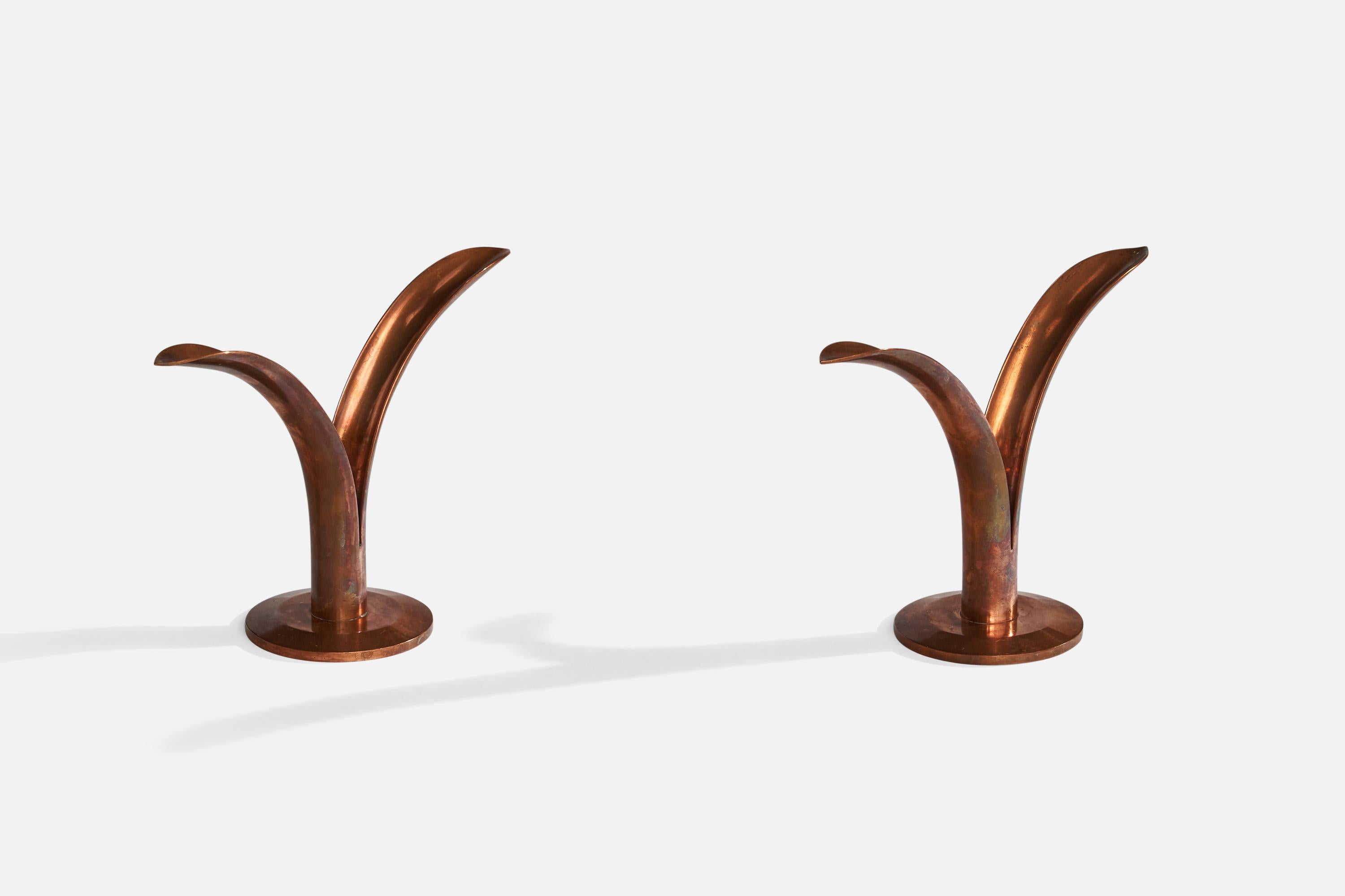 A pair copper candlesticks designed and produced in Sweden, c. 1950s.

Holds 0.8” diameter candles