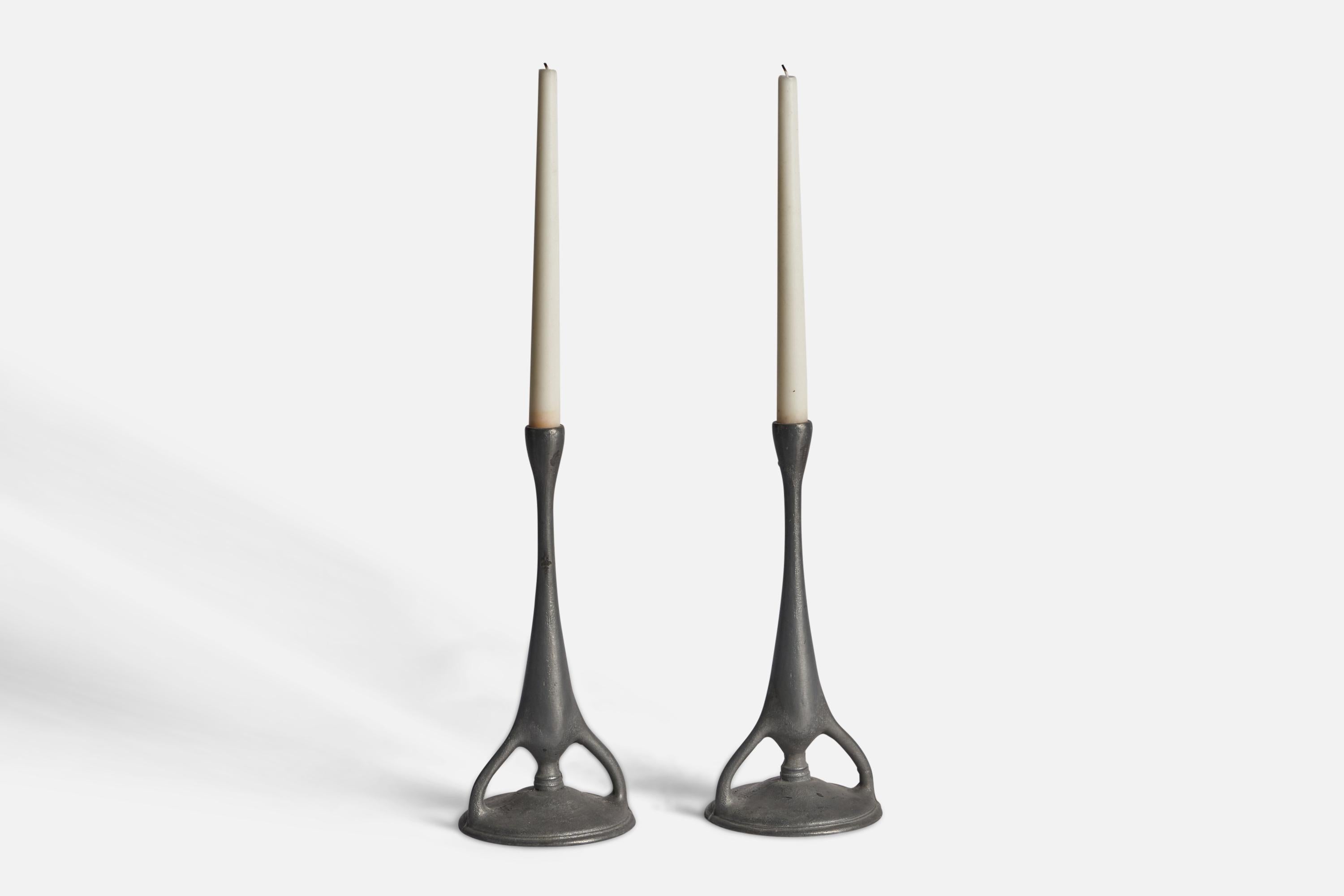 A pair of pewter candlesticks designed and produced in Sweden, 1930s.

Holds 0.65” diameter candles