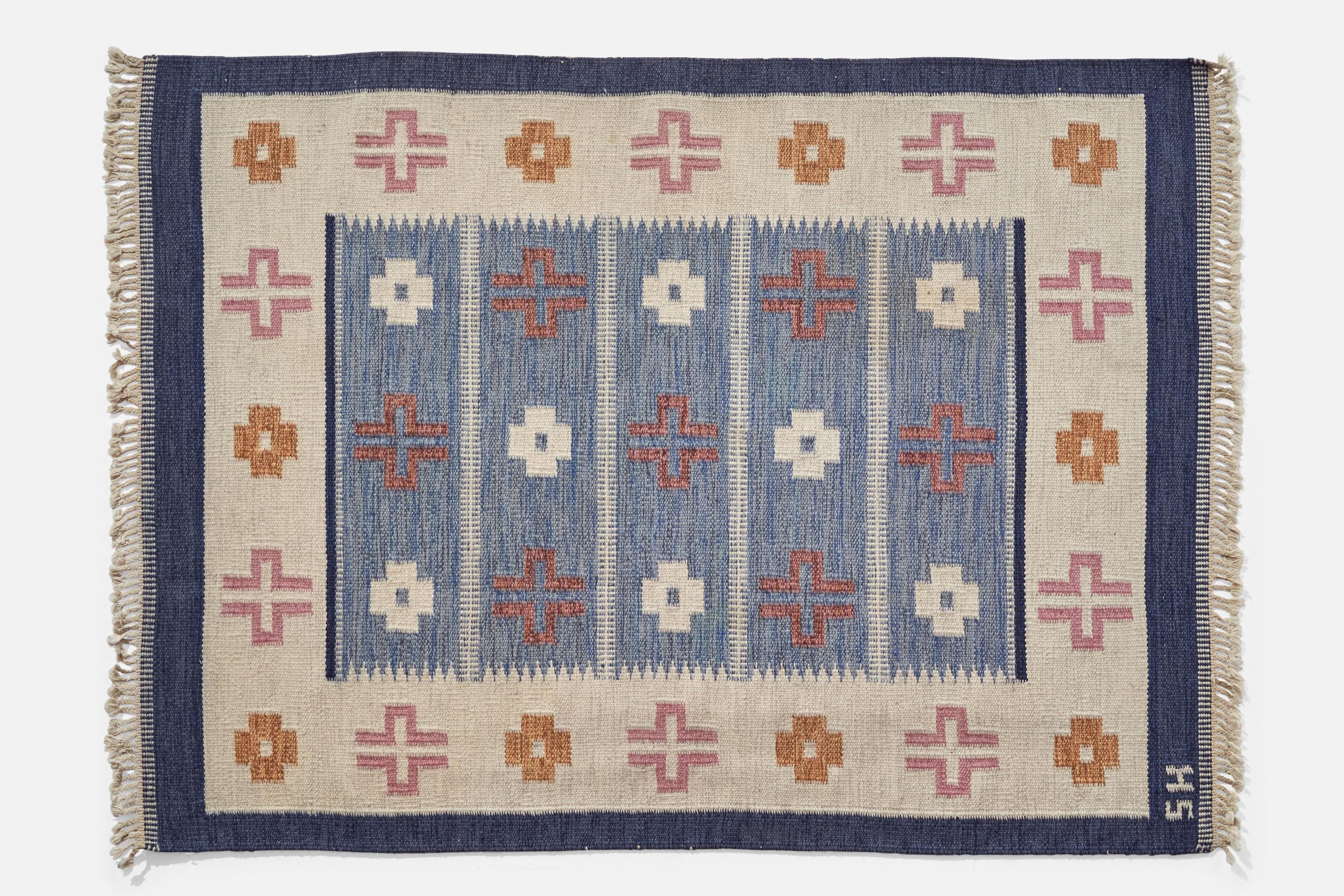 A blue, pink, orange and off-white flat weave wood carpet designed and produced in Sweden, c. 1950s.
 