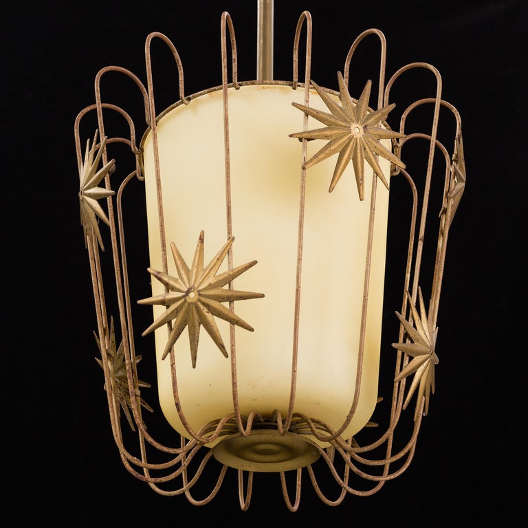 An organic modernist ceiling lamp / pendant. Designed and produced in Sweden, 1930s. Champagne-colored glass is framed in an ornamented brass structure. With excellent patina. 

Other designers of the period include Josef Frank, Hans Bergström,
