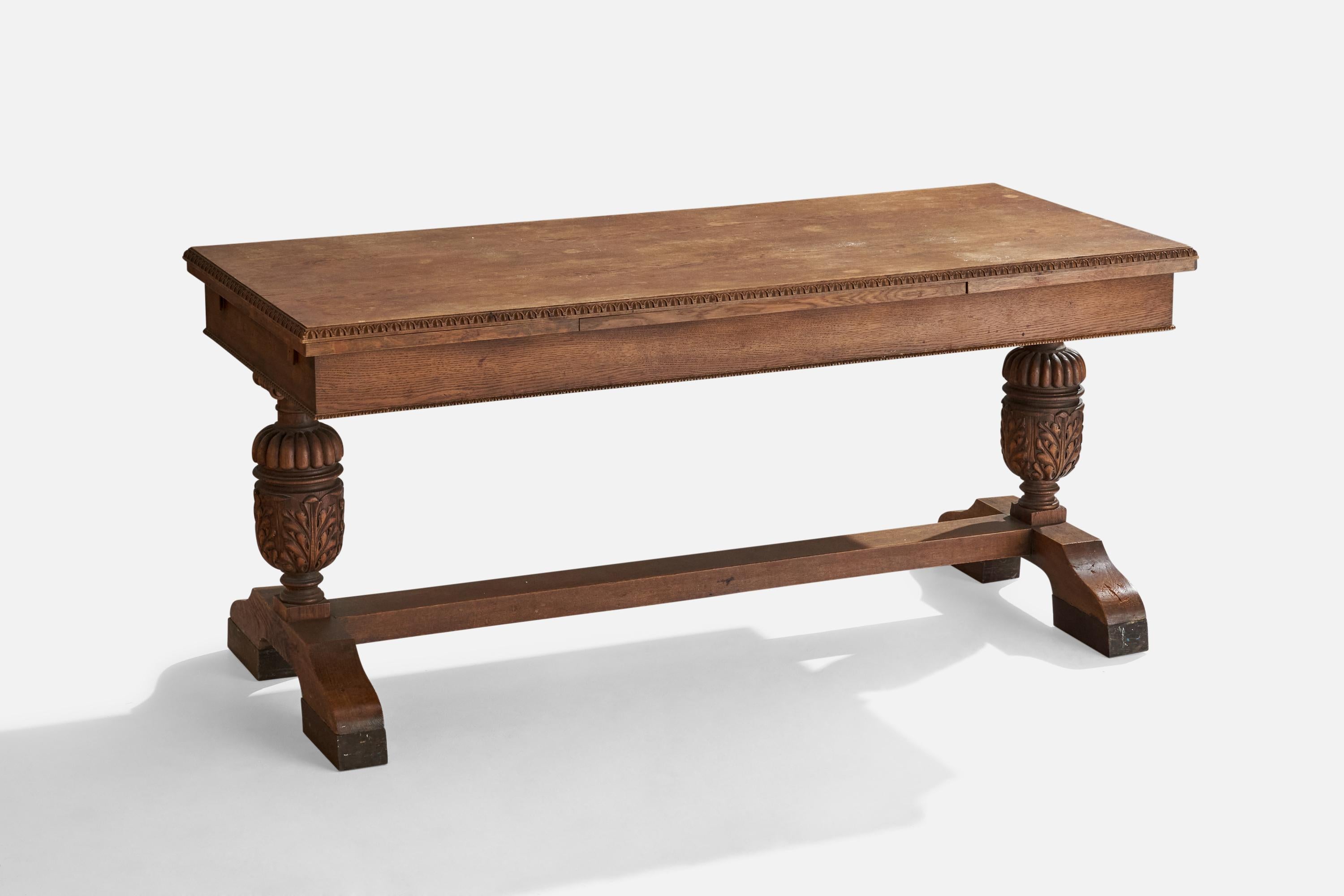 An extendable oak center or dining table designed and produced in Sweden, c. 1930s.
