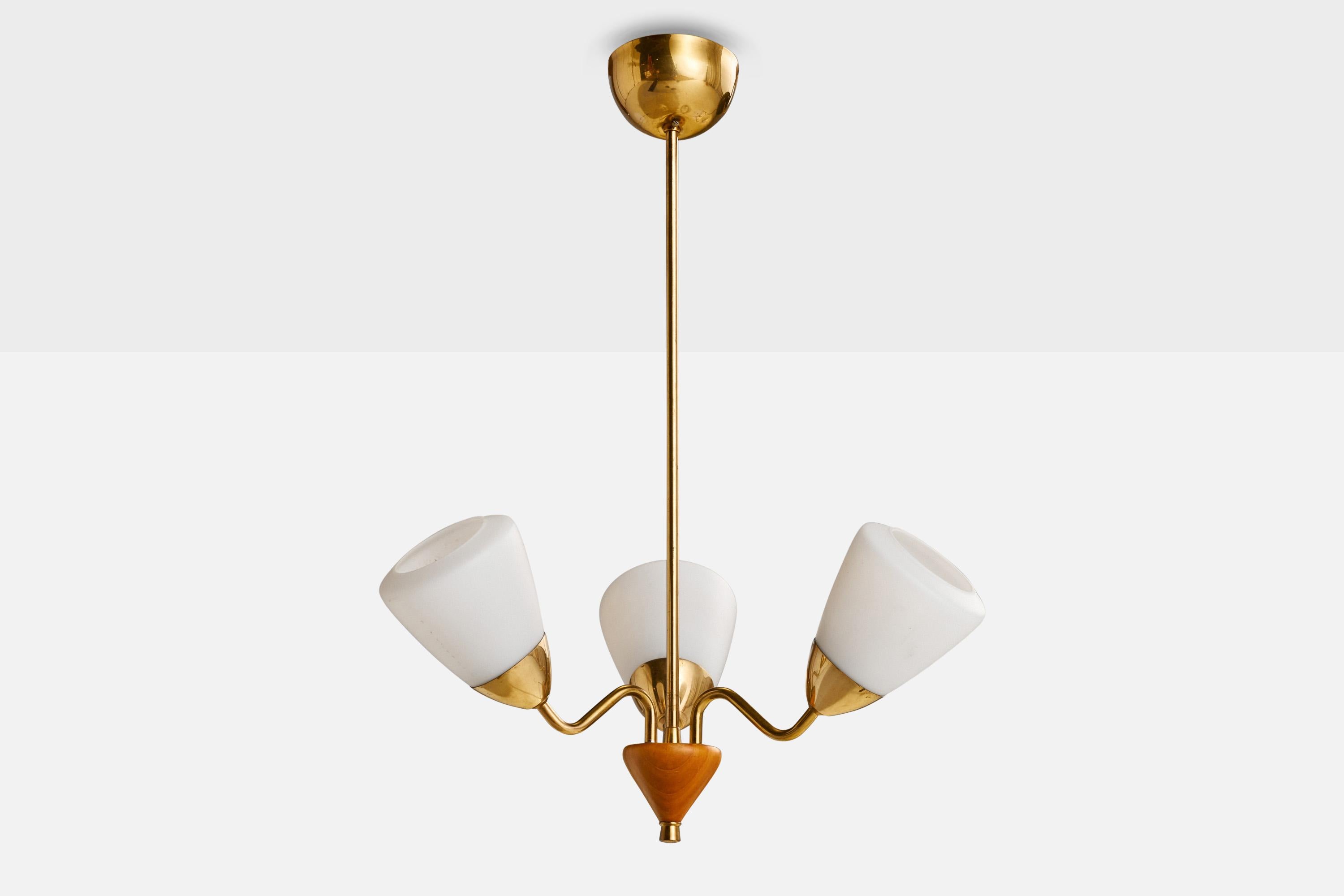 A brass, elm and opaline glass chandelier designed and produced in Sweden, 1940s

Dimensions of canopy (inches): 2.5” H x 3.75” Diameter
Socket takes standard E-26 bulbs. 3 sockets.There is no maximum wattage stated on the fixture. All lighting will