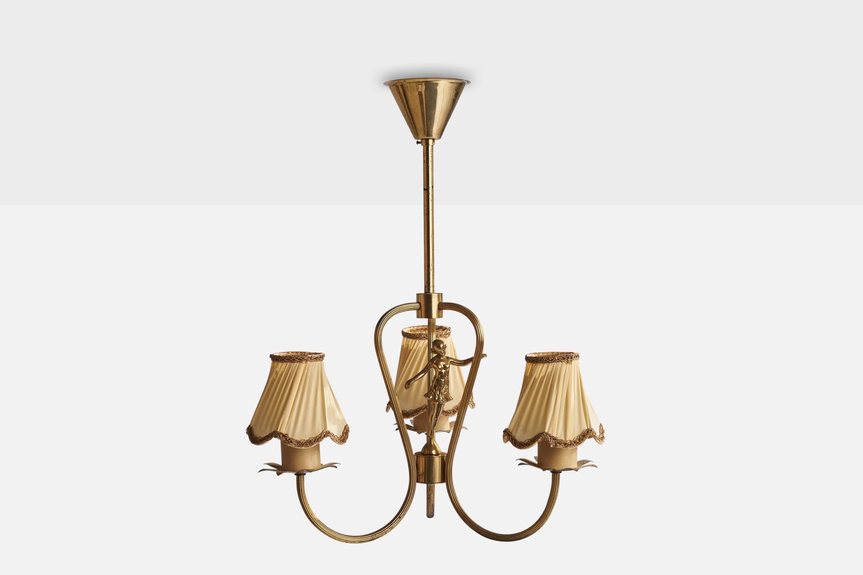 A brass and off-white fabric chandelier designed and produced in Sweden, 1930s.

Dimensions of canopy (inches): 3.25” H x 4”  Diameter
Socket takes standard E-26 bulbs. 3 sockets.There is no maximum wattage stated on the fixture. All lighting will