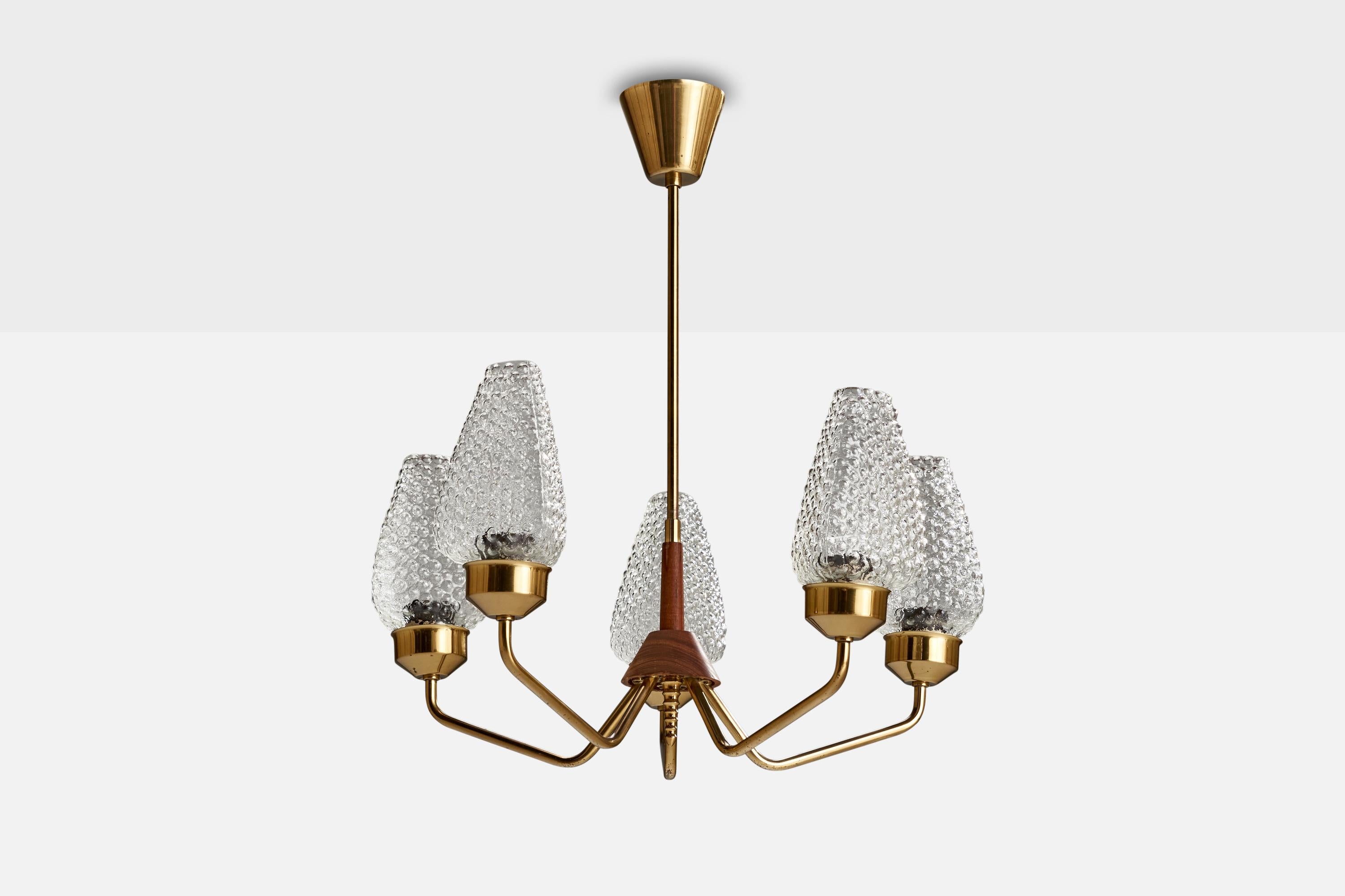 A brass, stained oak and glass chandelier designed and produced in Sweden, c. 1950s.

Dimensions of canopy (inches): 3.17” H x 3.55” Diameter
Socket takes standard E-26 bulbs. 5 socket.There is no maximum wattage stated on the fixture. All lighting
