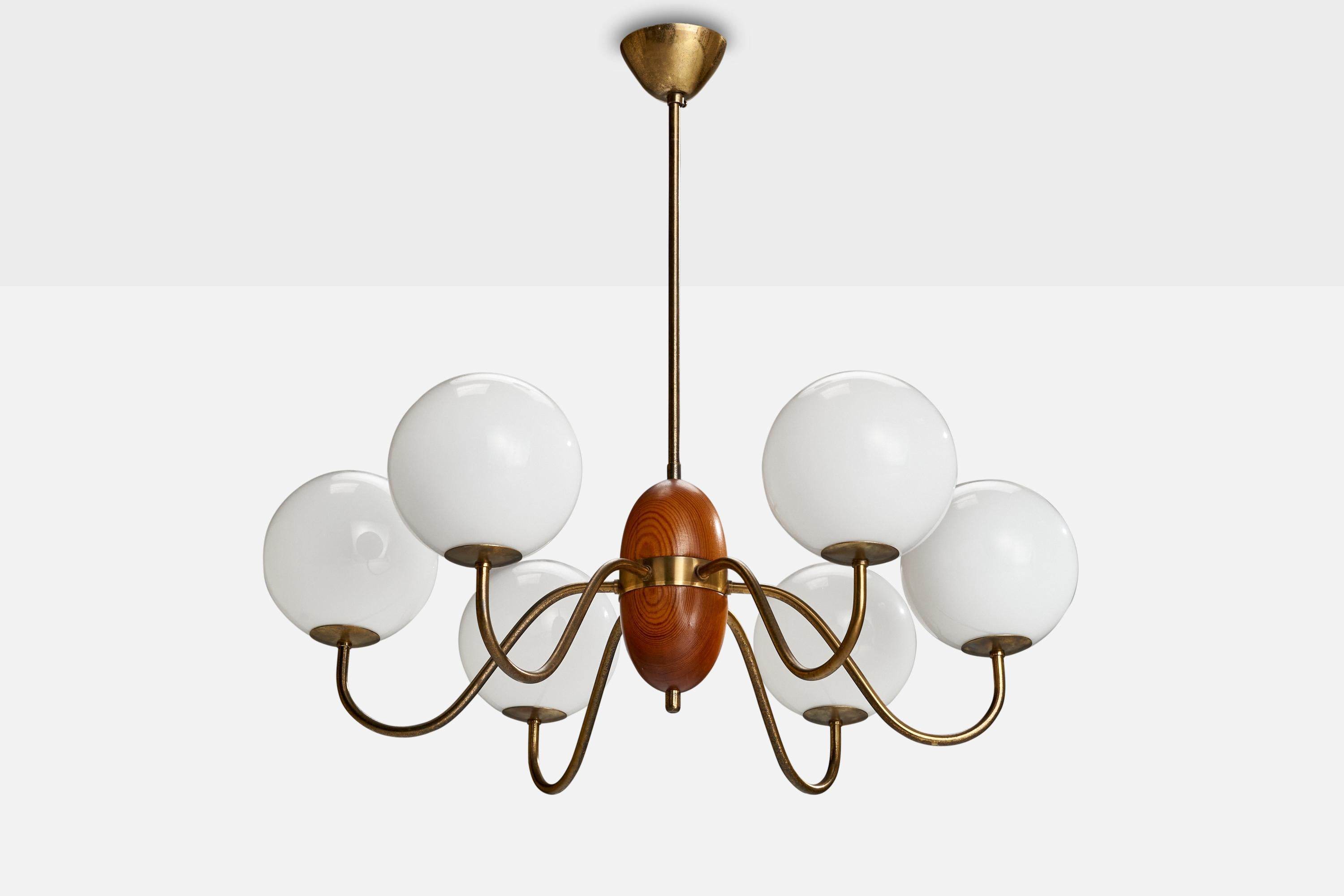 A brass, opaline glass and stained pine chandelier designed and produced in Sweden, c. 1950s.

Dimensions of canopy (inches): 2.03” H x 3.73” Diameter
Socket takes standard E-14 bulbs. 6 socket.There is no maximum wattage stated on the fixture. All