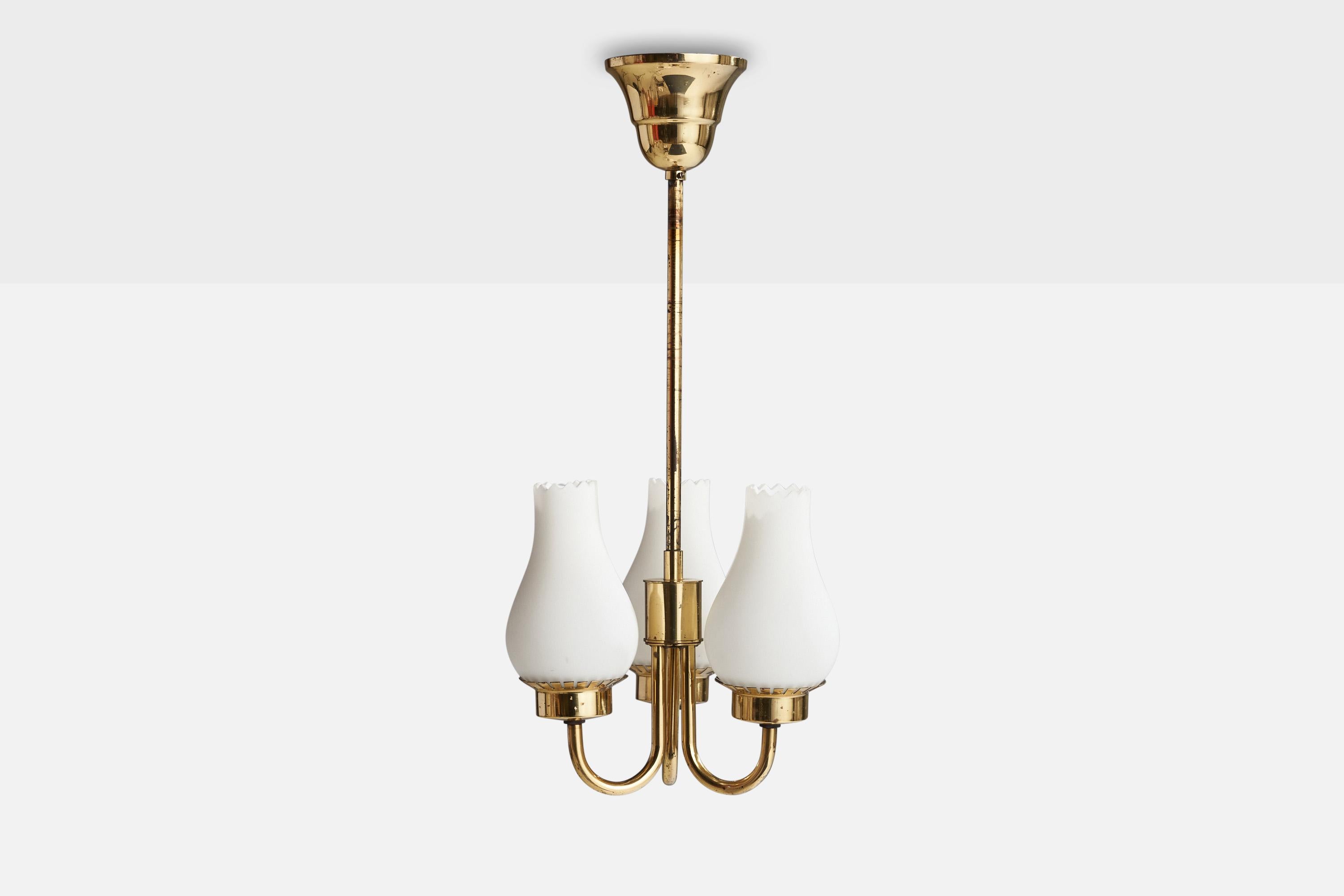 A brass and opaline glass chandelier designed and produced in Sweden, c. 1940s.

Dimensions of canopy (inches): 3.25” H x 3.75”  Diameter
Socket takes standard E-14 bulbs. 3 sockets.There is no maximum wattage stated on the fixture. All lighting