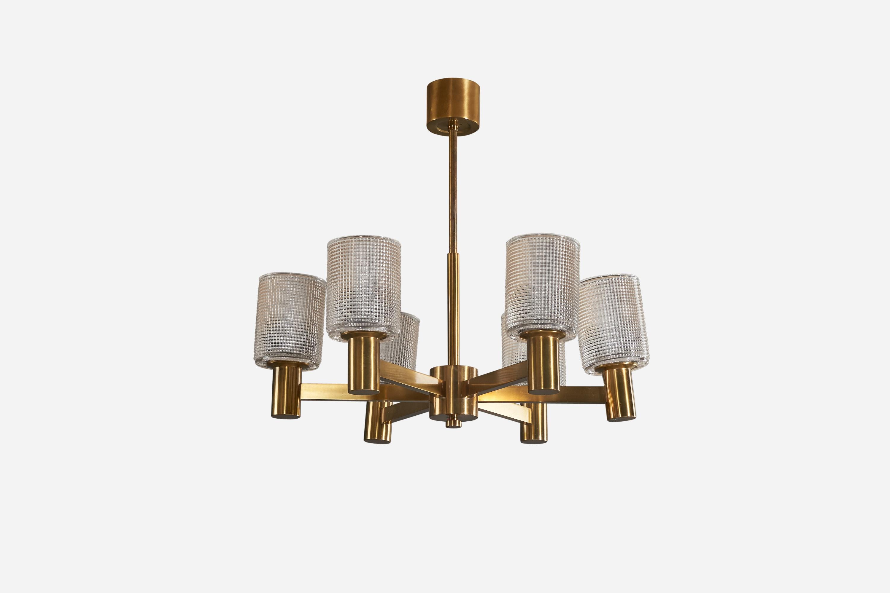 A six-armed chandelier in brass and glass designed and produced by a Swedish designer, Sweden, 1950s.

Canopy Dimensions: 2.62 x 3.37 x 3.37 (H x W x D).