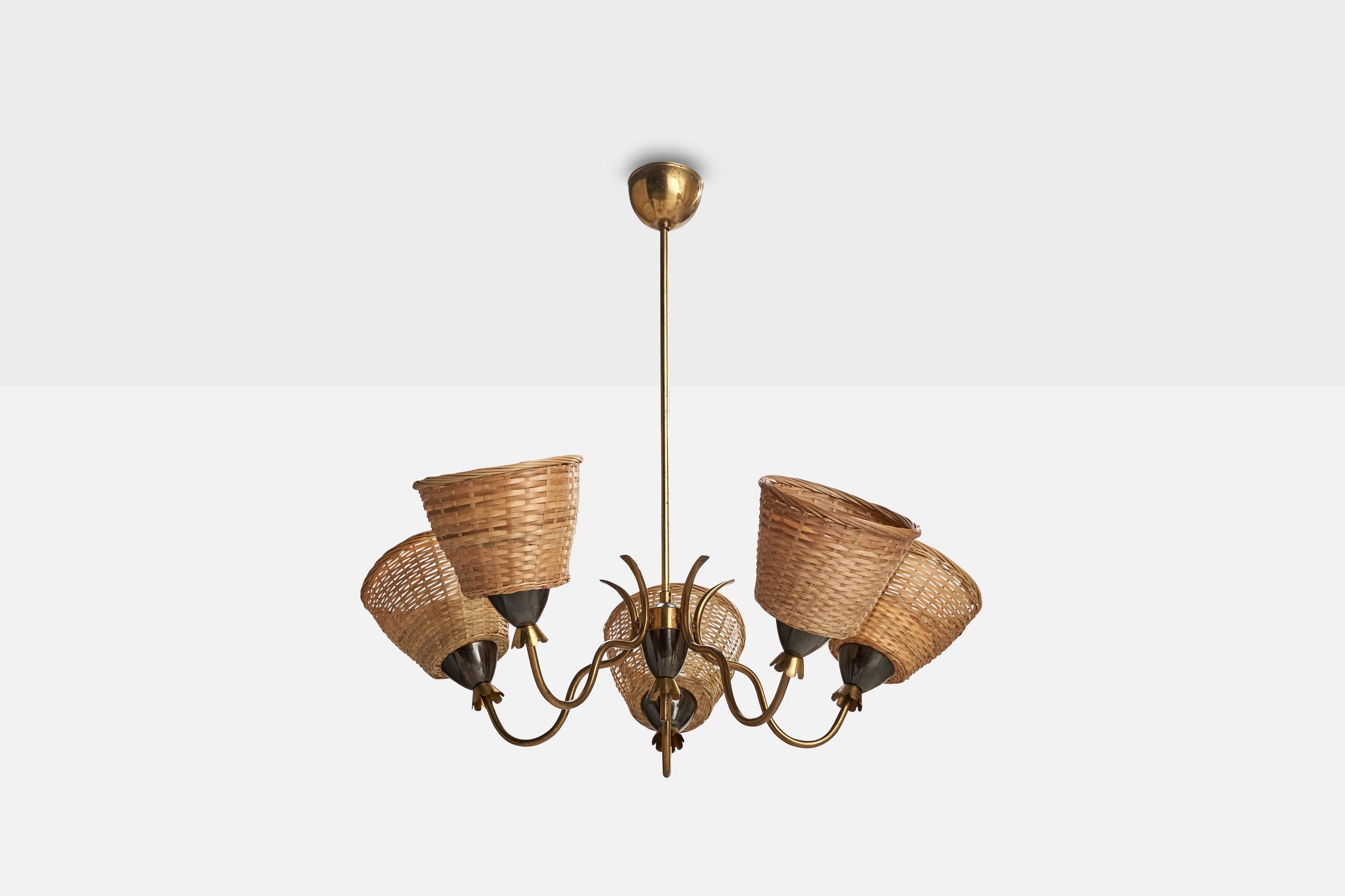 A brass, metal and rattan chandelier designed and produced in Sweden, c. 1950s. 

Dimensions of canopy (inches): 3.67” H x 2.77” Diameter
Socket takes standard E-26 bulbs. 5 socket.There is no maximum wattage stated on the fixture. All lighting will