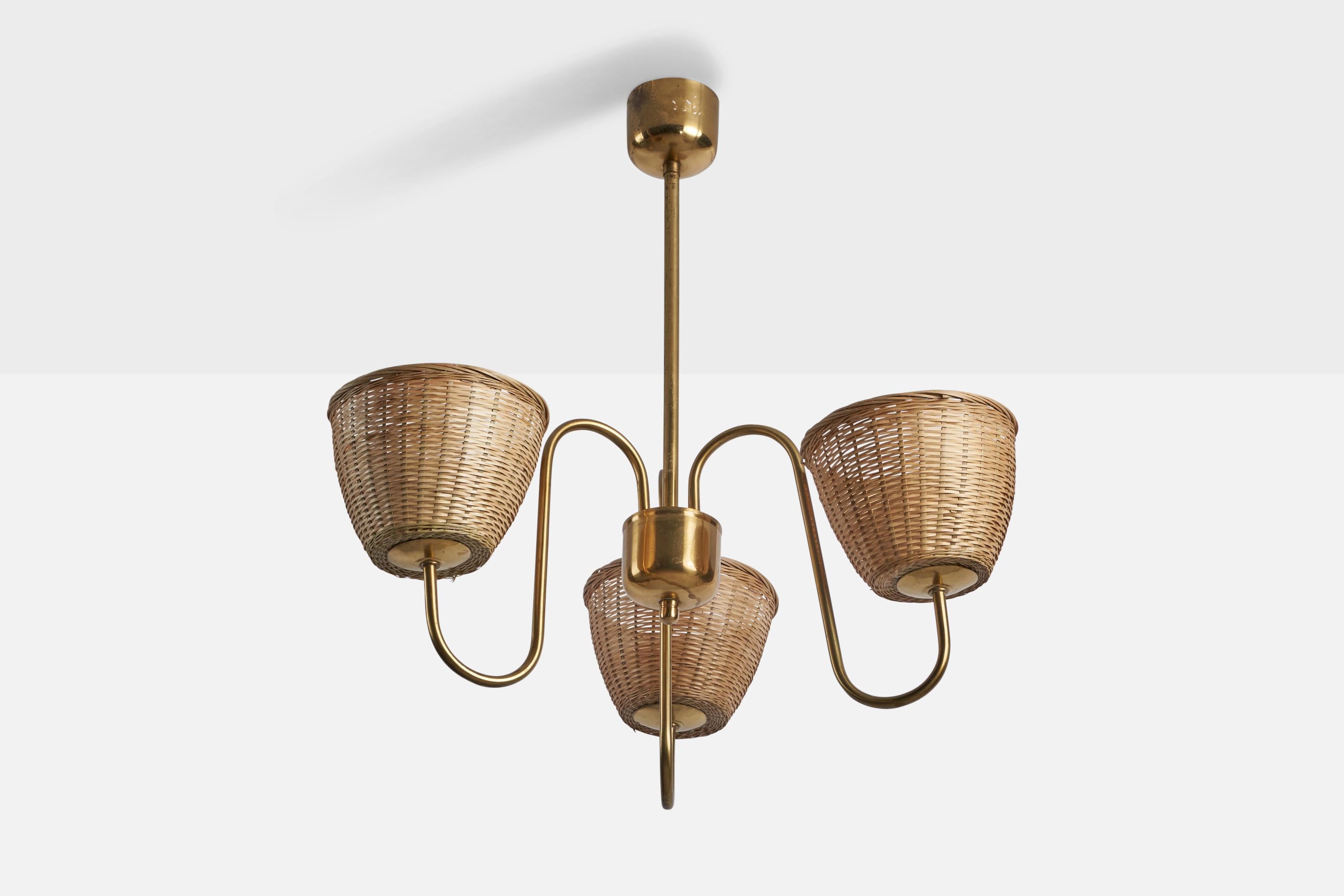 A three-armed brass and rattan chandelier designed and produced in Sweden, 1940s.

Overall Dimensions (inches): 24” H x 21” Diameter
Bulb Specifications: E-26 Bulb
Number of Sockets: 3