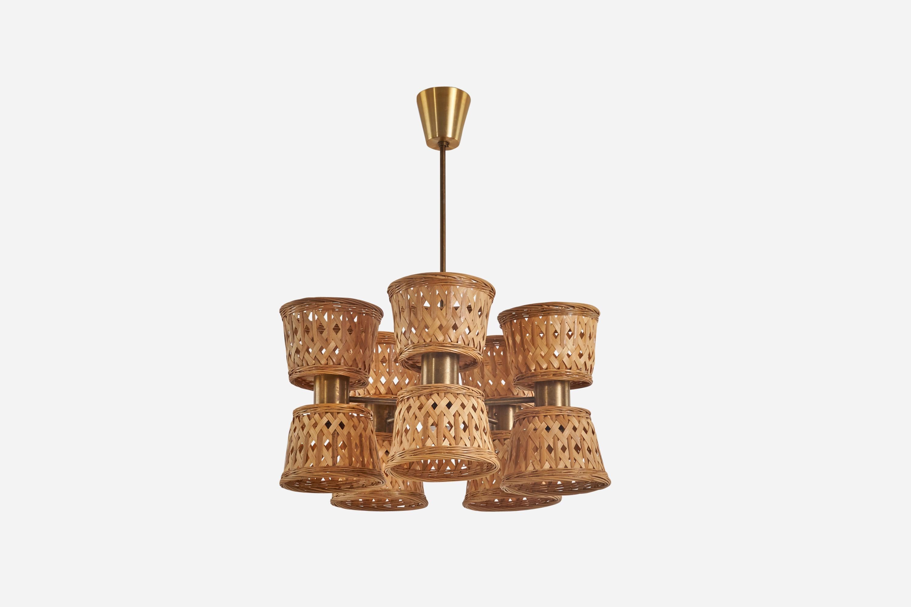 A brass and rattan chandelier designed and produced by a Swedish designer, Sweden, 1950s.

Sold with Lampshade(s). Dimensions stated are of Chandelier with Shade(s).

Socket takes E-14 bulb.

There is no maximum wattage stated on the