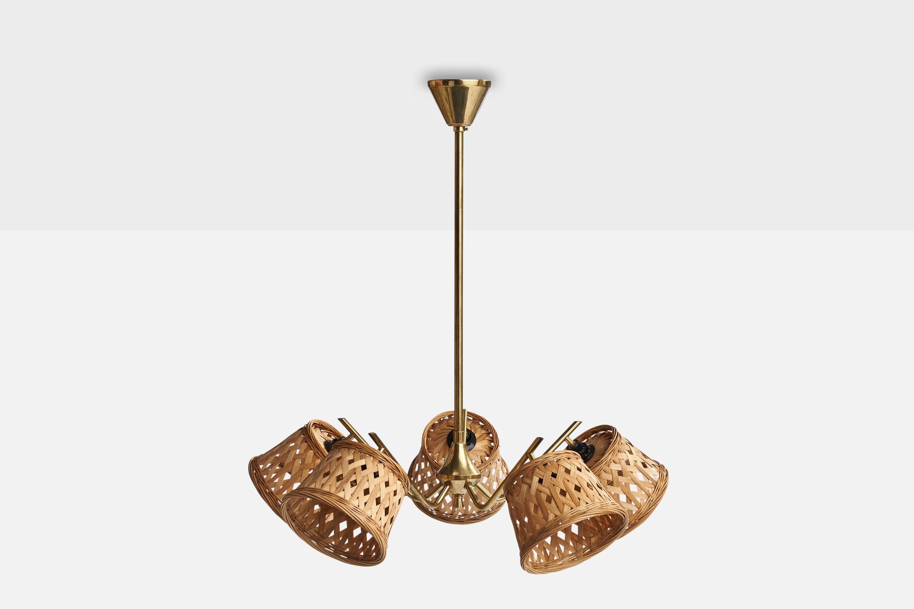A brass and rattan chandelier designed and produced in Sweden, 1950s.

Dimensions of canopy (inches): 2.5” H x 3.5” Diameter
Socket takes standard E-14 bulbs. 5 sockets.There is no maximum wattage stated on the fixture. All lighting will be