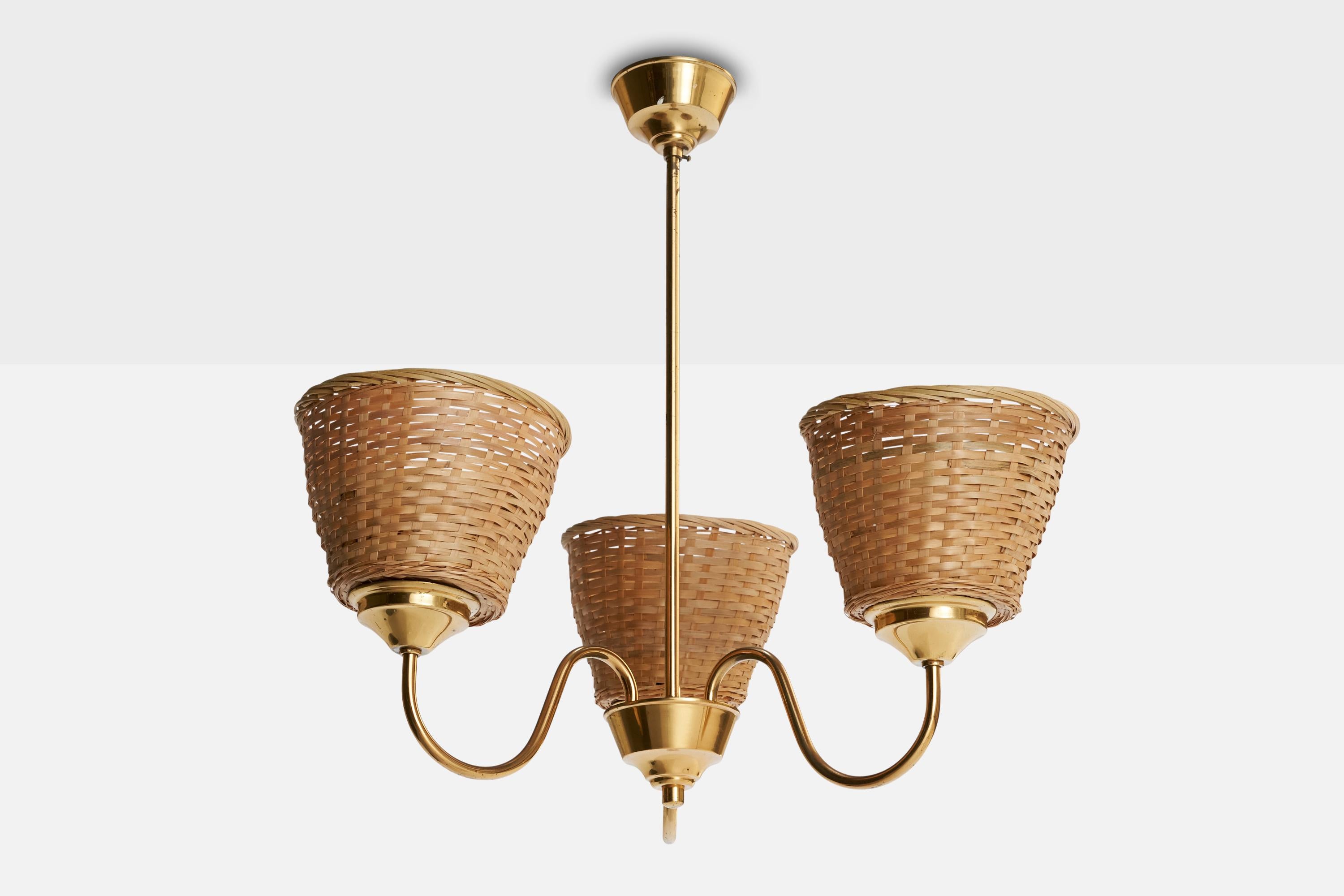 A brass and rattan chandelier designed and produced in Sweden, c. 1950s.

Assorted rattan lampshades.

Overall Dimensions (inches): 21 ” H x 20 ” Diameter

Dimensions of Canopy: 2.125 ” H x 3.5” W x 3.5” D

Stem length: 15” H

Bulb Specifications:
