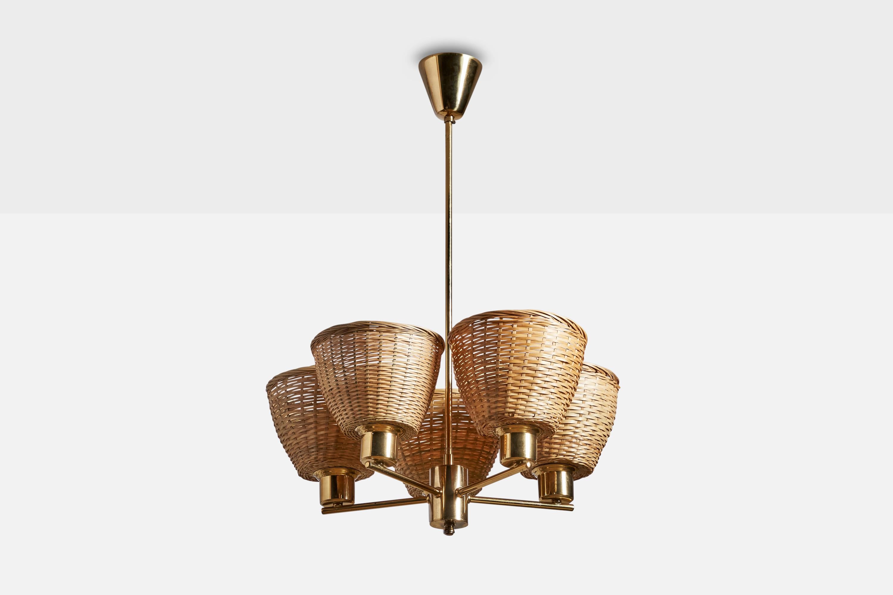 A brass and rattan chandelier designed and produced in Sweden, 1960s.

Dimensions of canopy (inches): 3” H x 3.25” Diameter
Socket takes standard E-26 bulbs. 5 sockets.There is no maximum wattage stated on the fixture. All lighting will be converted