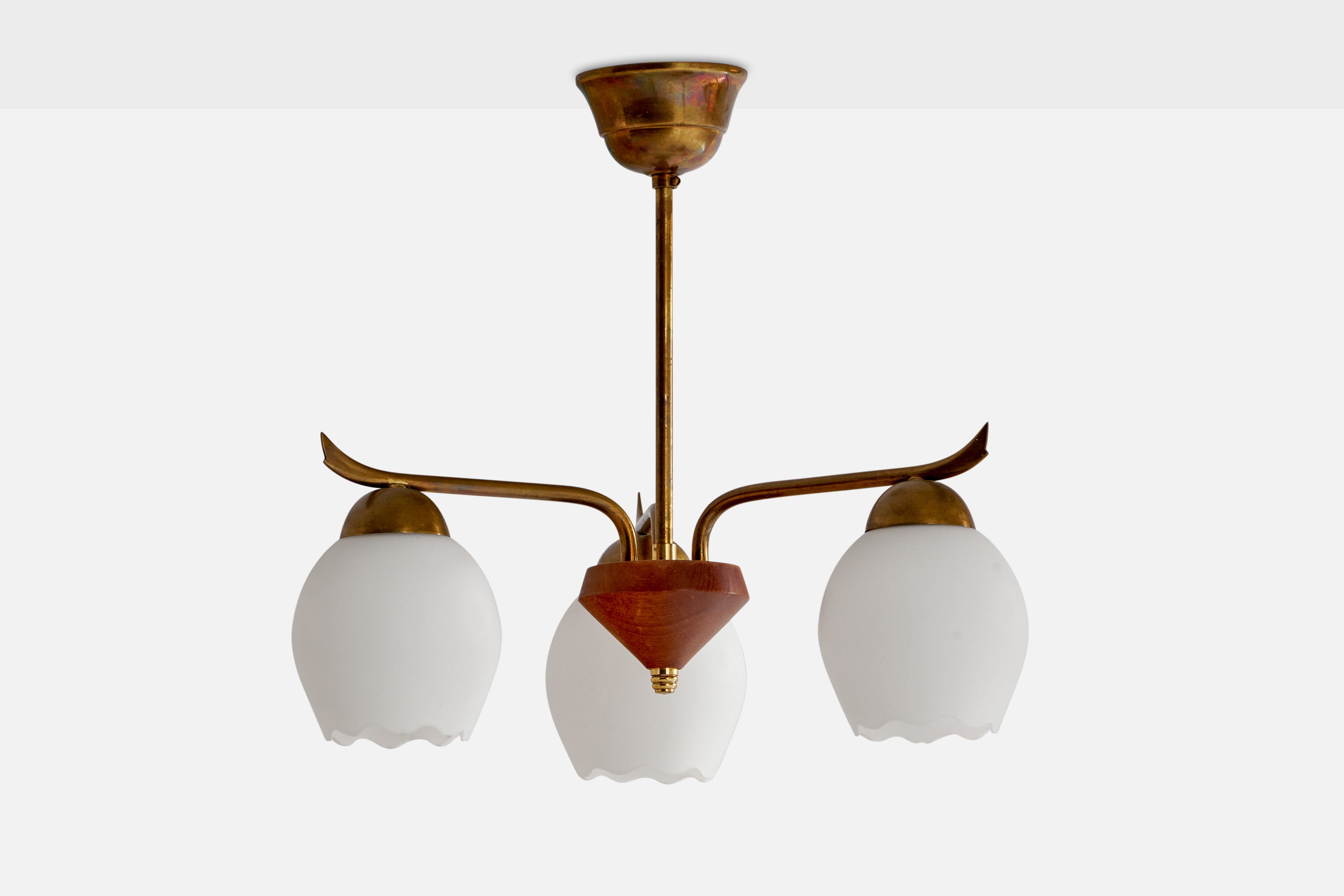 A brass, teak and opaline glass chandelier designed and produced in Sweden, 1950s.

Dimensions of canopy (inches): 2.3” H x 3.6” Diameter
Socket takes standard E-26 bulbs. 3 sockets.There is no maximum wattage stated on the fixture. All lighting