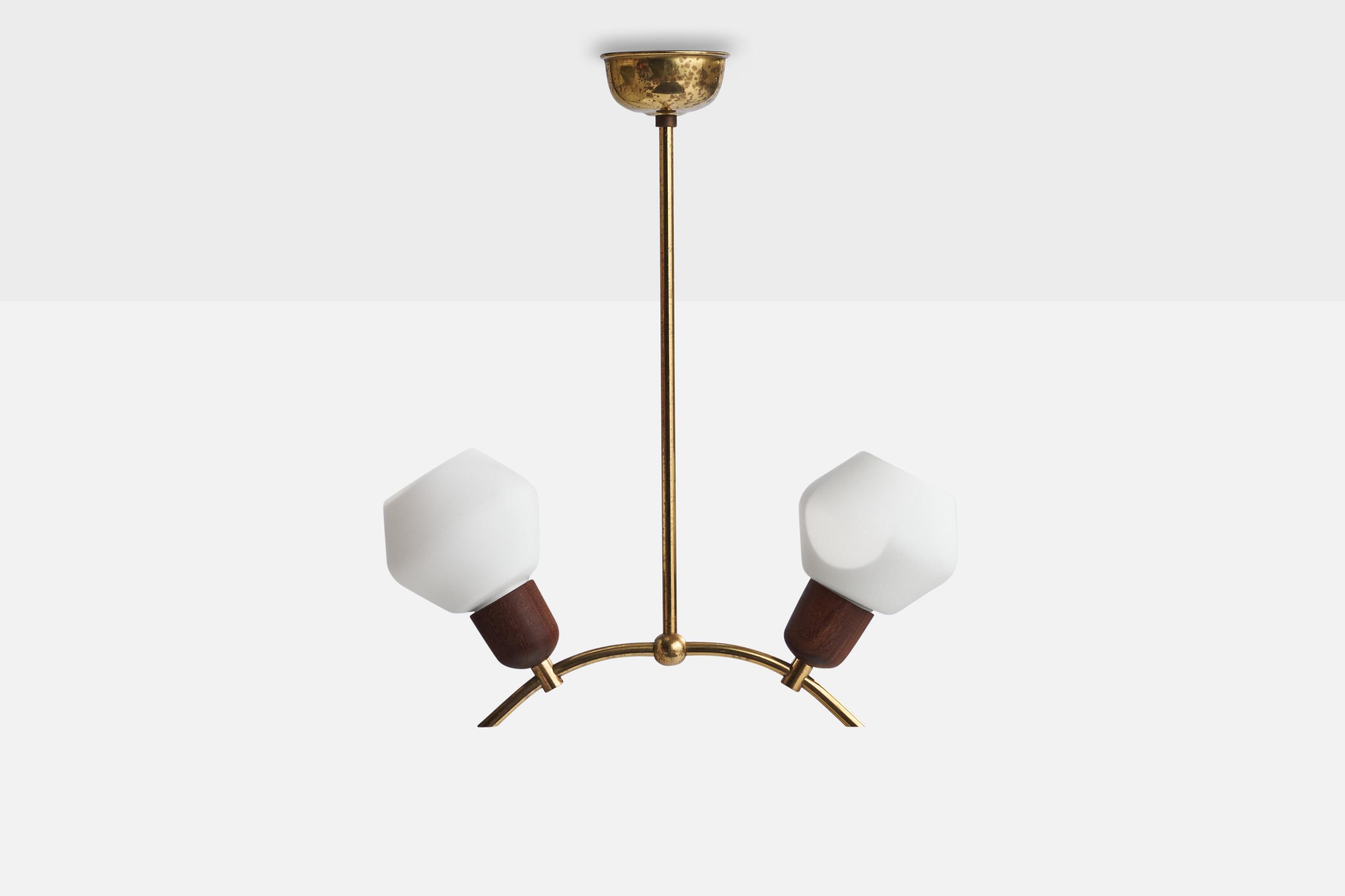 A brass, teak and opaline glass pendant light designed and produced in Sweden, 1950s.

Dimensions of canopy (inches): 1.75”  H x 3.25” Diameter
Socket takes standard E-14 bulbs. 2 sockets.There is no maximum wattage stated on the fixture. All
