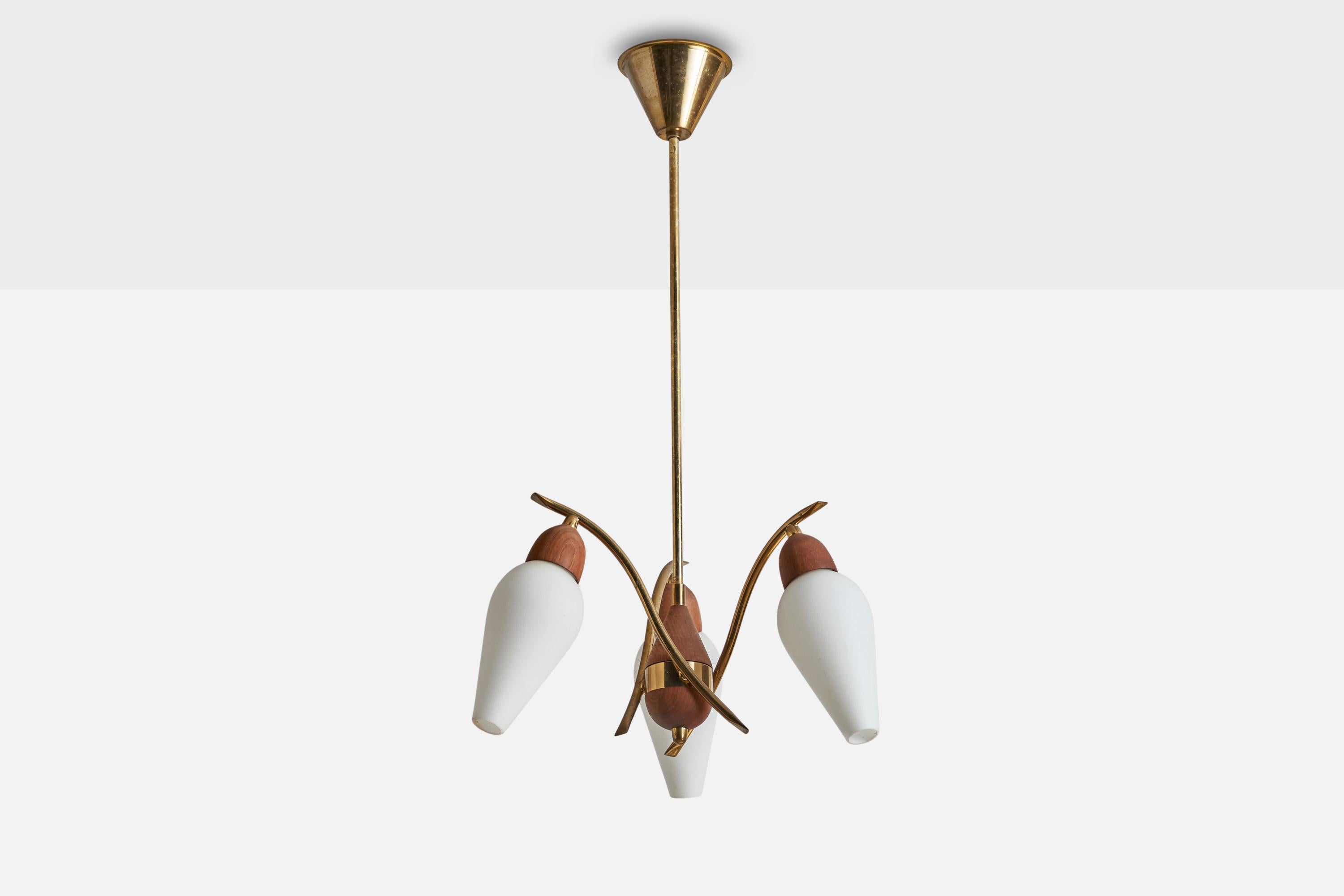 A brass, teak and opaline glass chandelier designed and produced in Sweden, 1950s.

Dimensions of canopy (inches): 2.75”  H x 4” Diameter
Socket takes standard E-14 bulbs. 3 sockets.There is no maximum wattage stated on the fixture. All lighting