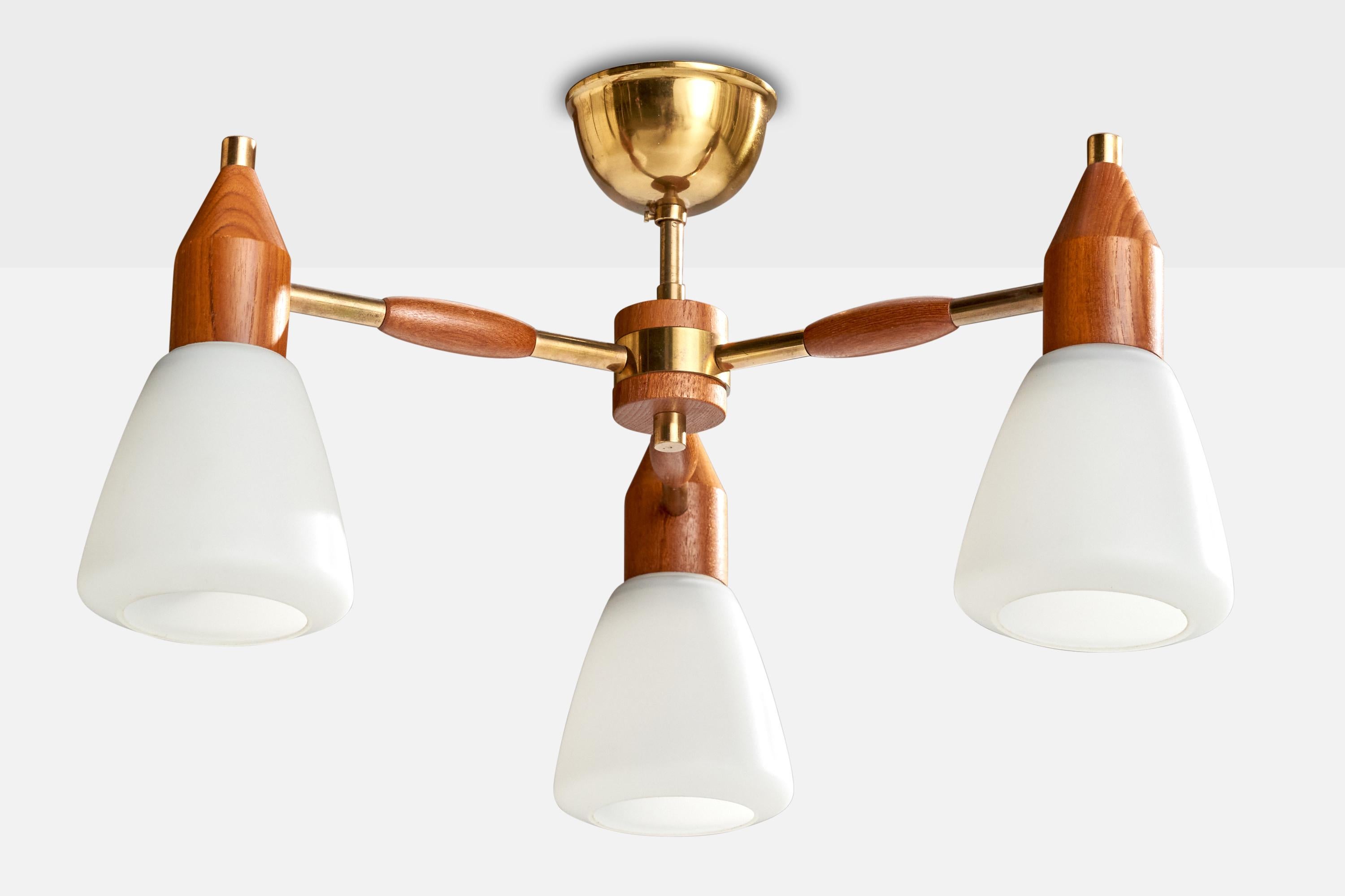 A brass, teak and white opaline glass chandelier designed and produced in Sweden, c. 1950s.

Overall Dimensions (inches): 10.5” H x 16.5” Diameter

Dimensions of Canopy:  2” H x 3.5” W x 3.5” D

Bulb Specifications: E-26  

Number of Sockets: 3

All