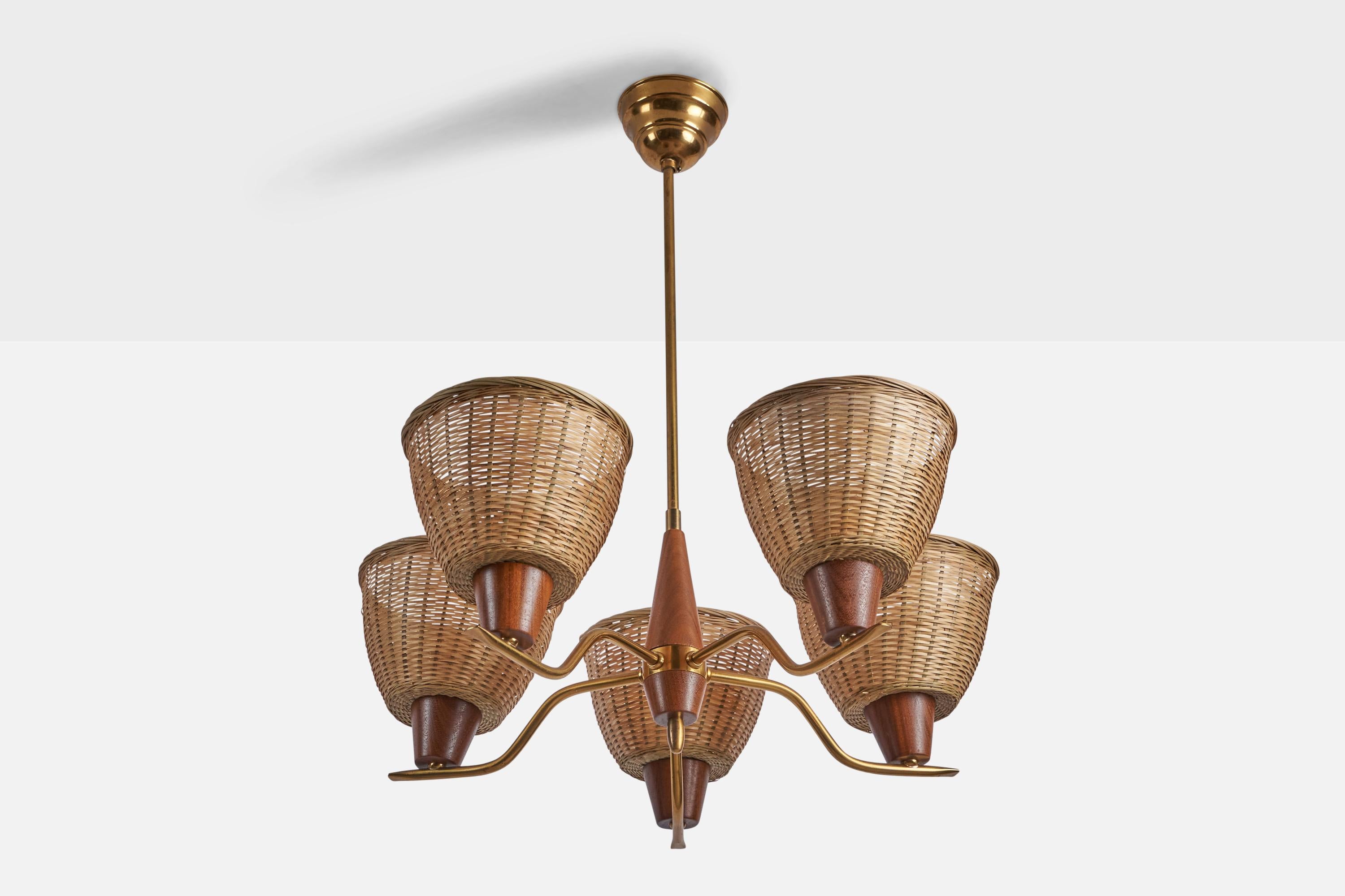 A five-armed brass, teak and rattan chandelier designed and produced in Sweden, 1950s.

Overall Dimensions (inches): 25” H x 21” Diameter
Bulb Specifications: E-26 Bulb
Number of Sockets: 5