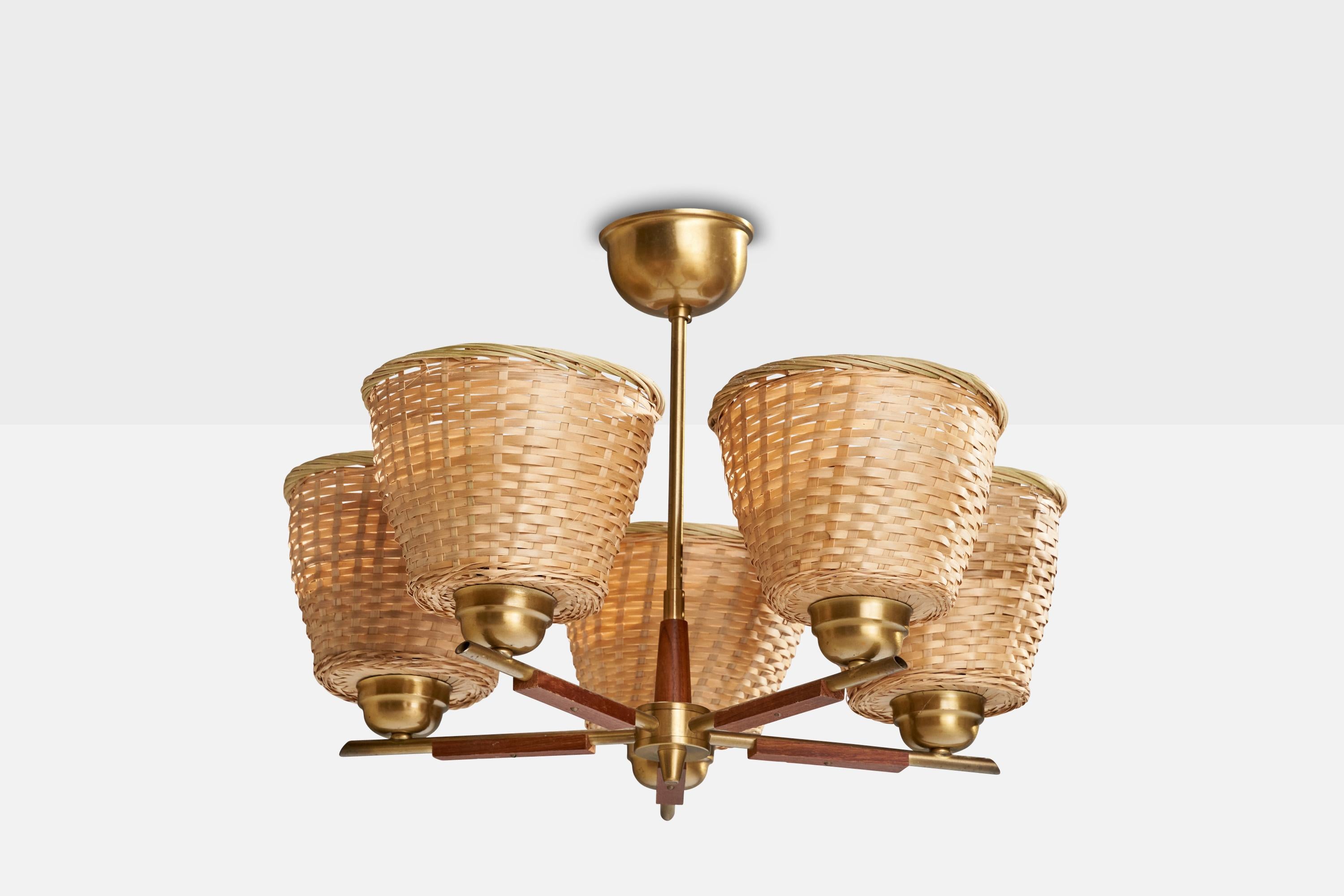 A teak, brass and rattan chandelier designed and produced in Sweden, c. 1950s.

Dimensions of canopy (inches): 2.63” H x 3.5” Diameter
Socket takes standard E-26 bulbs. 1 socket.There is no maximum wattage stated on the fixture. All lighting will be
