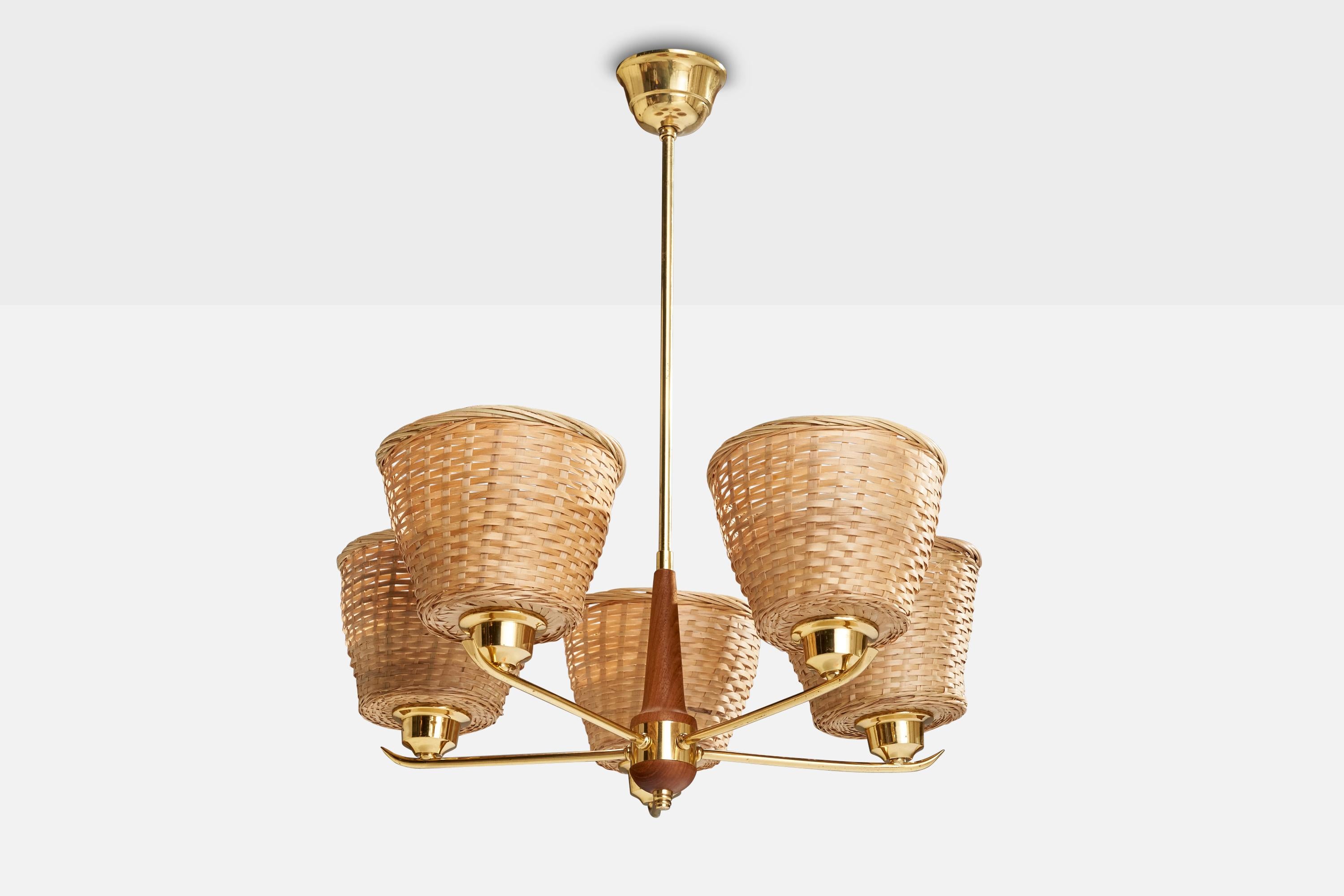 A brass, teak and rattan chandelier designed and produced in Sweden, c. 1950s.

Dimensions of canopy (inches): 1.85” H x 3.6” Diameter
Socket takes standard E-26 bulbs. 5 socket.There is no maximum wattage stated on the fixture. All lighting will be