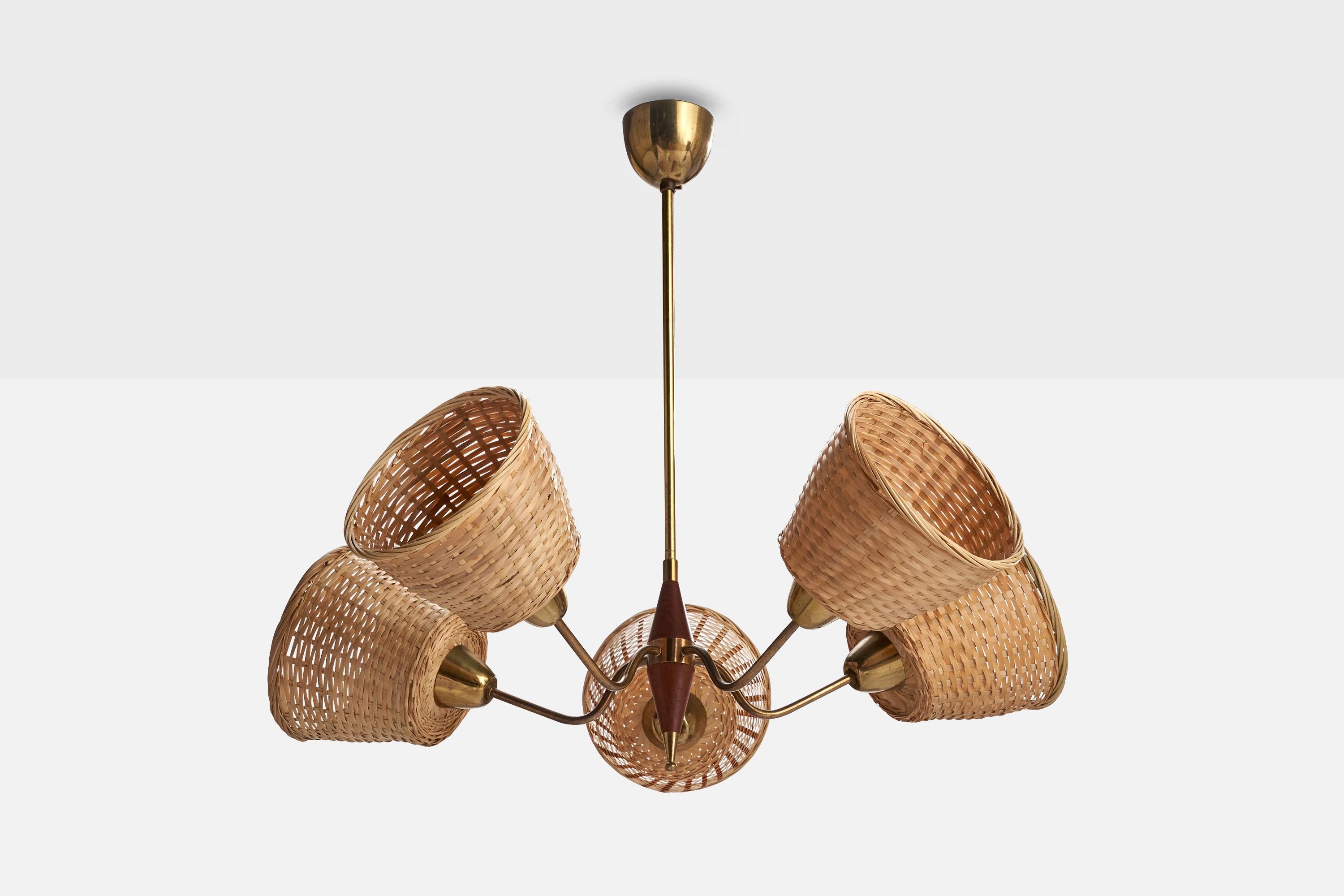 A brass, teak and rattan chandelier designed and produced in Sweden, c. 1950s.

Dimensions of canopy (inches): 3.20” H x 2.70” Diameter
Socket takes standard E-26 bulbs. 5 socket.There is no maximum wattage stated on the fixture. All lighting will