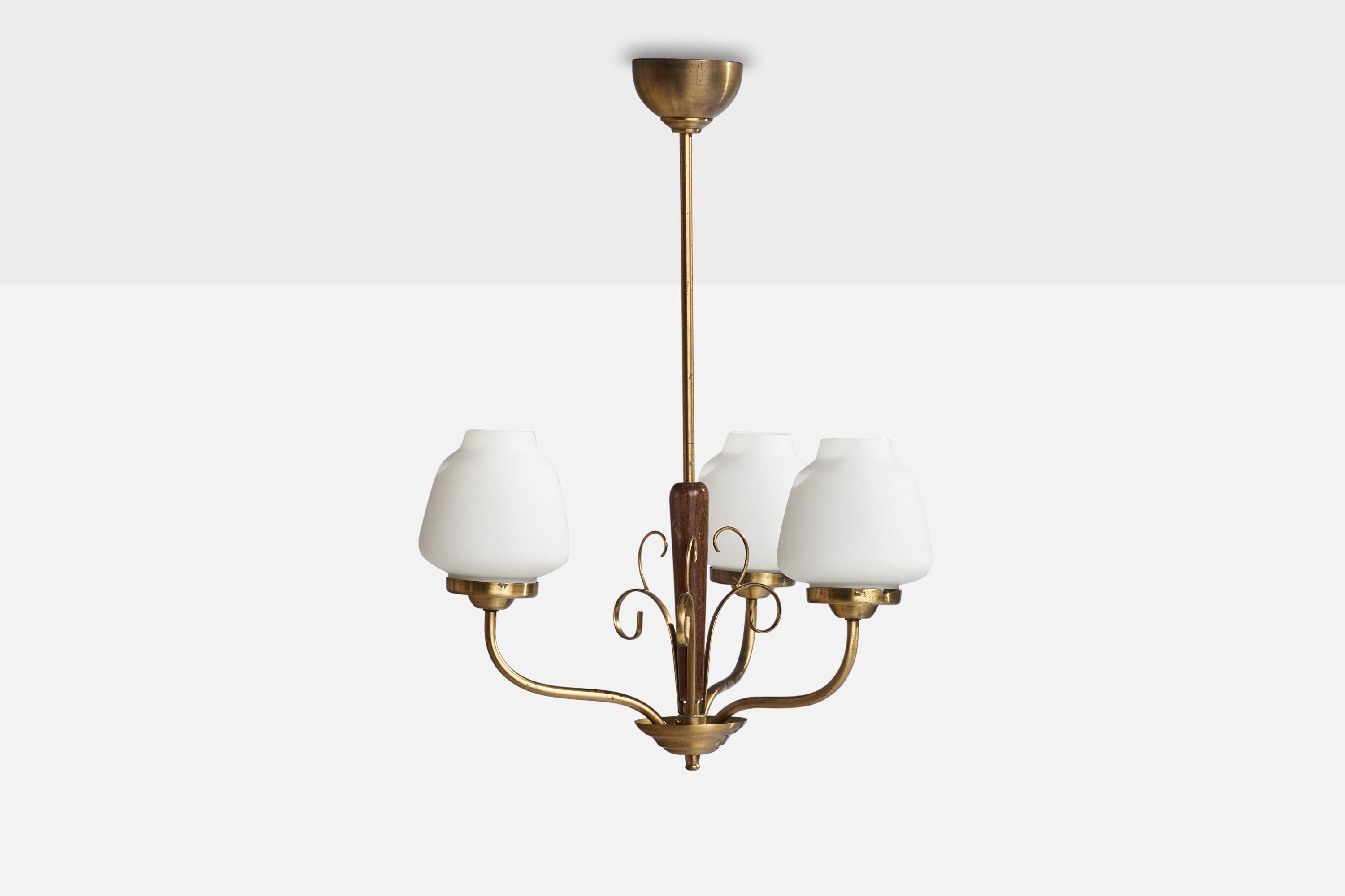 A brass, walnut and opaline chandelier designed and produced in Sweden, 1940s.

Dimensions of canopy (inches): 2.25” H x 3.5” Diameter
Socket takes standard E-26 bulbs. 3 sockets.There is no maximum wattage stated on the fixture. All lighting will