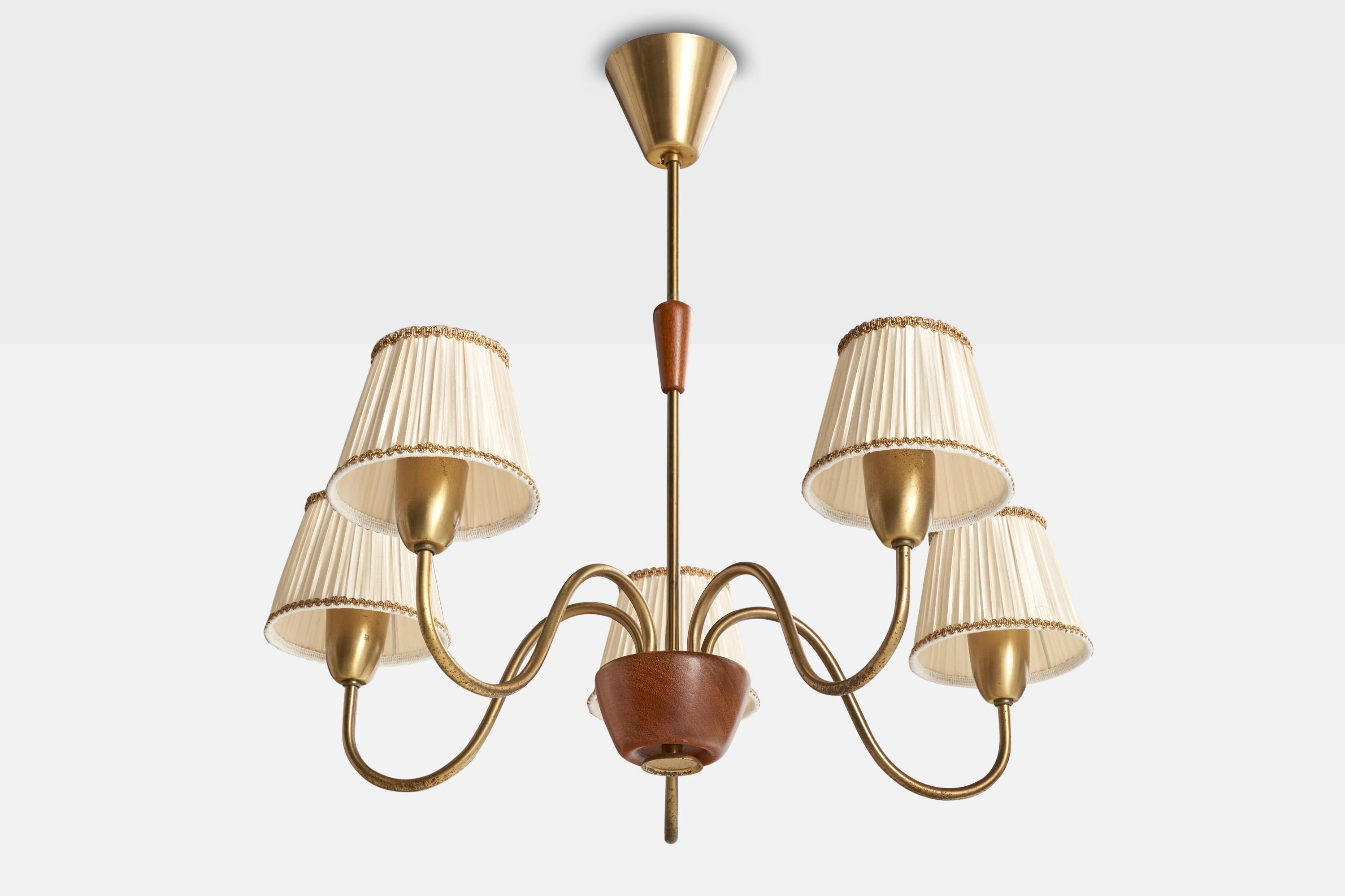 A wood, brass and white fabric chandelier designed and produced in Sweden, c. 1940s.

Light discoloration to lampshades.

Overall Dimensions (inches): 23” H x 26” Diameter

Dimensions of Canopy:  3.5” H x 4” W x 4” D

Stem length: 17” H

Bulb
