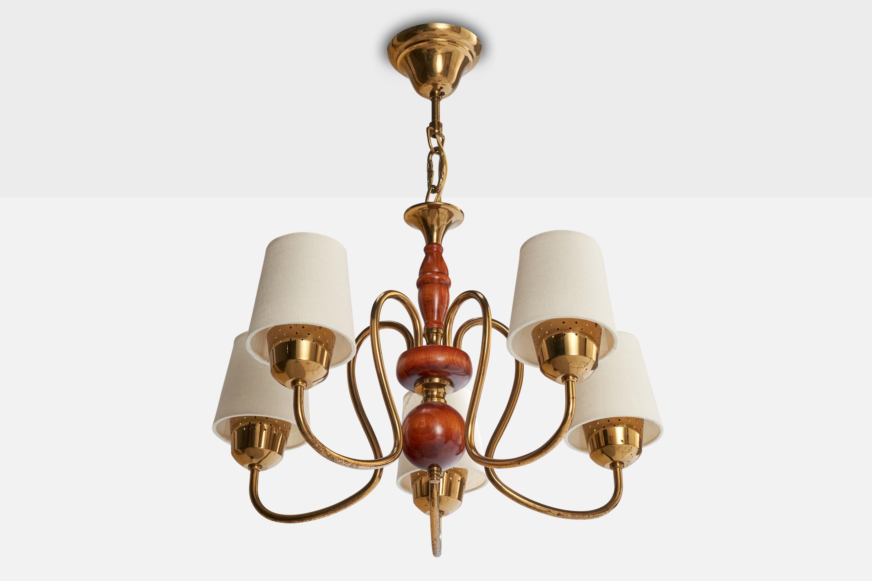 A brass, stained wood and white fabric chandelier designed and produced in Sweden, c. 1940s.

Overall Dimensions (inches): 21” H x 18” Diameter

Dimensions of Canopy:  2.5” H x 4.25” W x 4.25” D

Bulb Specifications: E-14

Number of Sockets: 5

All