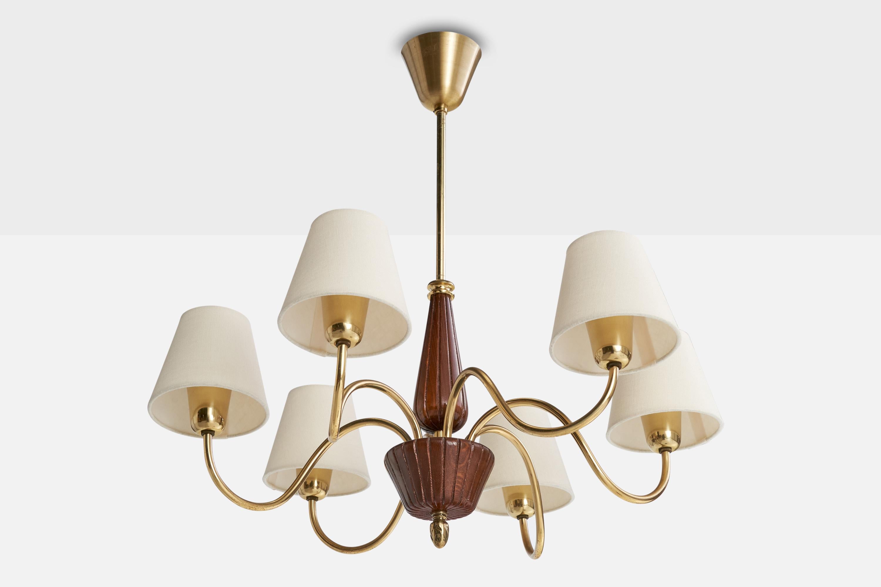 A brass, dark-stained wood and white fabric chandelier designed and produced in Sweden, c. 1940s.

Overall Dimensions (inches): 24” H x  23” Diameter

Dimensions of Canopy:  3” H x 3.75” Diameter

Stem length: 8” H

Bulb Specifications: E-26

Number