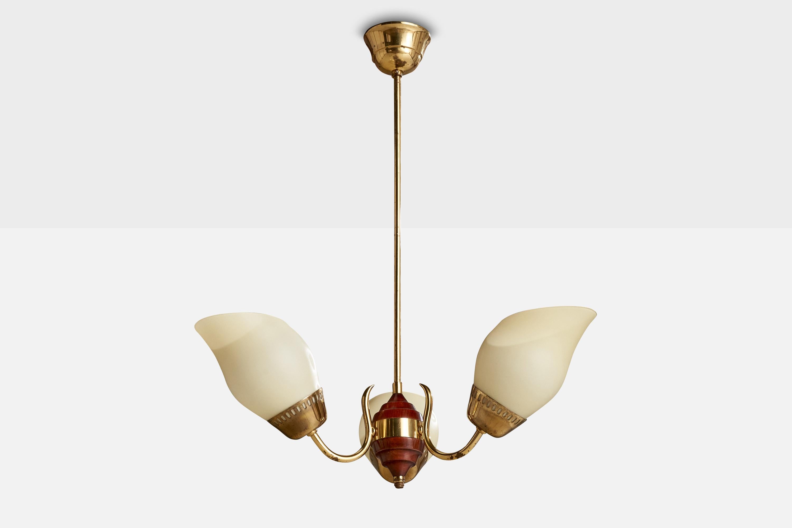 A brass, stained wood and opaline glass chandelier designed and produced in Sweden, c. 1940s.

Overall Dimensions (inches): 25.75” H x  19.375” Diameter
Dimensions of Canopy:  2.625” H x 3.625” W x 3.625” D
Stem length: 17.625”H
Bulb Specifications: