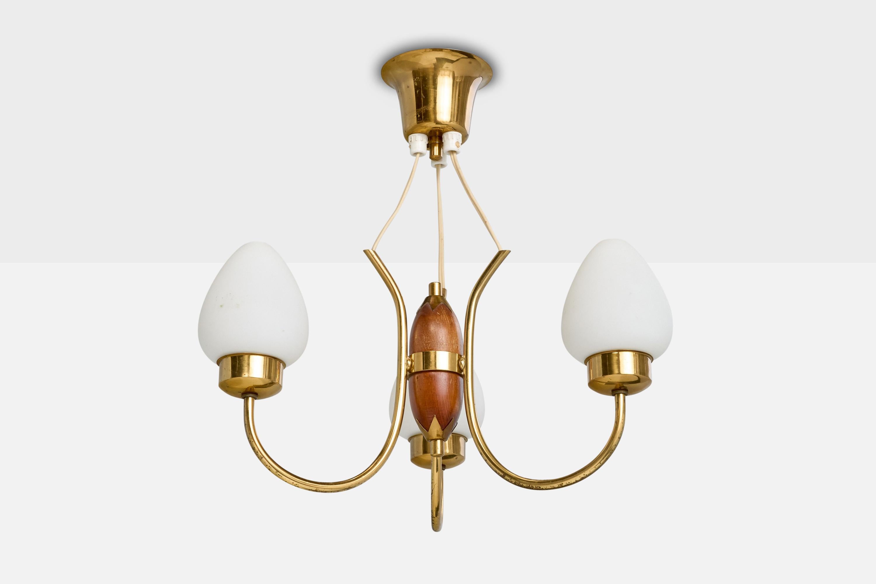 A brass, stained wood and white opaline glass chandelier designed and produced in Sweden, c. 1950s.

Overall Dimensions (inches): 16.7” H x 14.5” Diameter

Dimensions of Canopy: 3.5“ H x 4.3” Diameter 

Cord Length: 4.5” H

Bulb Specifications: