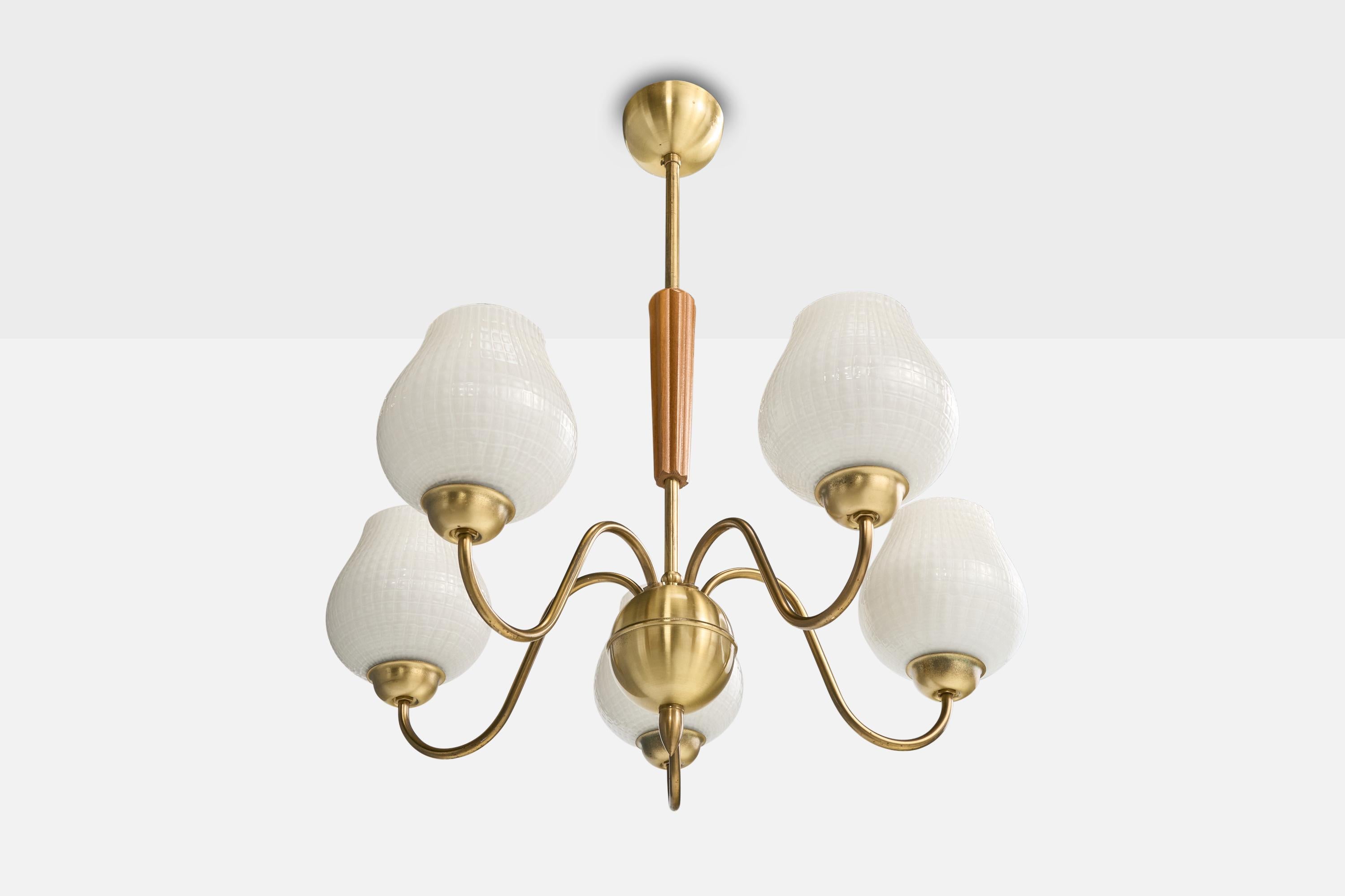 A brass, wood and glass chandelier designed and produced in Sweden, c. 1960s.

Overall Dimensions (inches): 25.5” H x 23” Diameter

Dimensions of Canopy: 2.4“ H x 4” Diameter 

Stem length: 6.5” H

Bulb Specifications: E-26 

Number of Sockets: