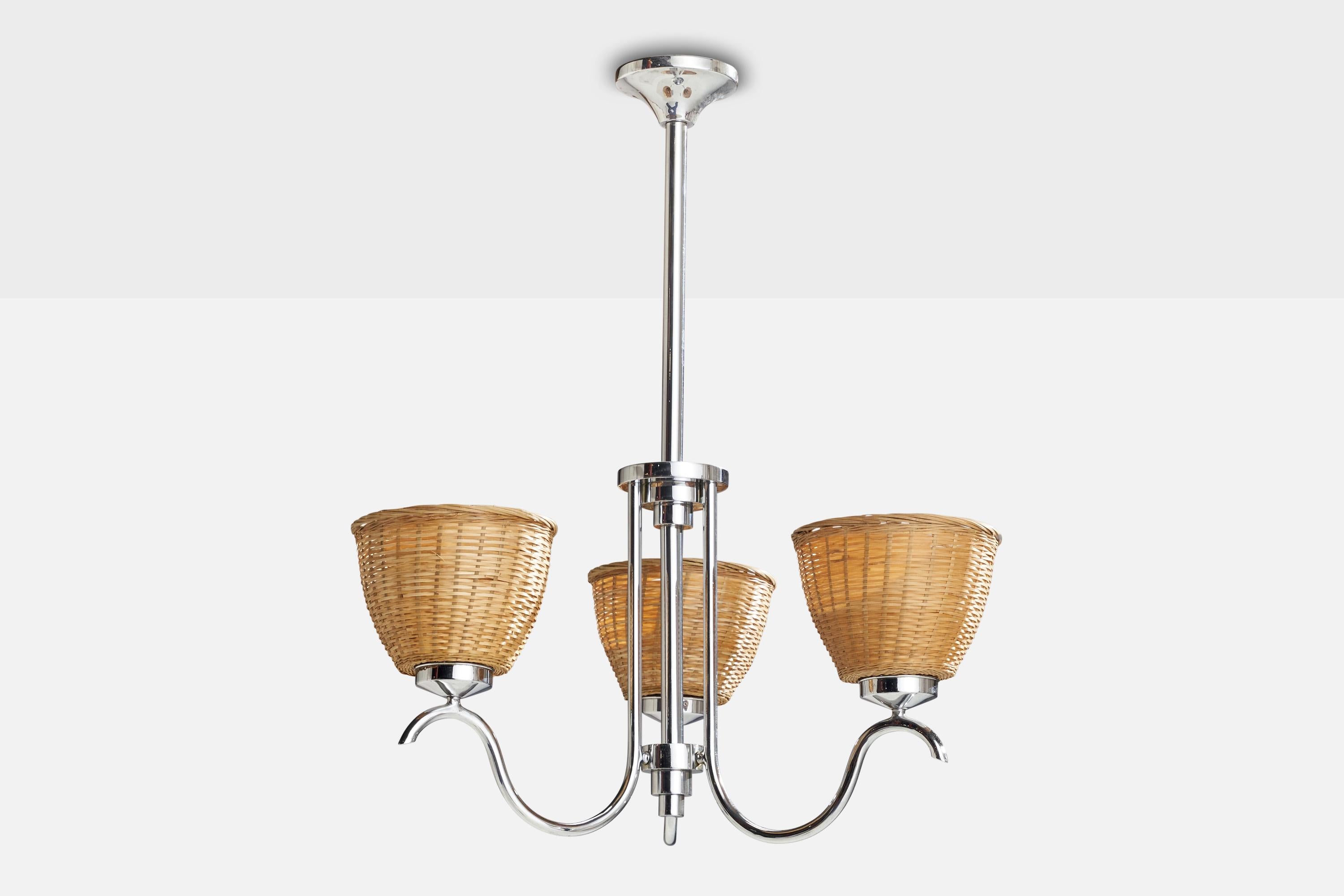 A chrome-plated metal and rattan chandelier designed and produced in Sweden, 1930s.

Dimensions of canopy (inches): 2” H x 4” Diameter
Socket takes standard E-26 bulbs. 3 sockets.There is no maximum wattage stated on the fixture. All lighting will