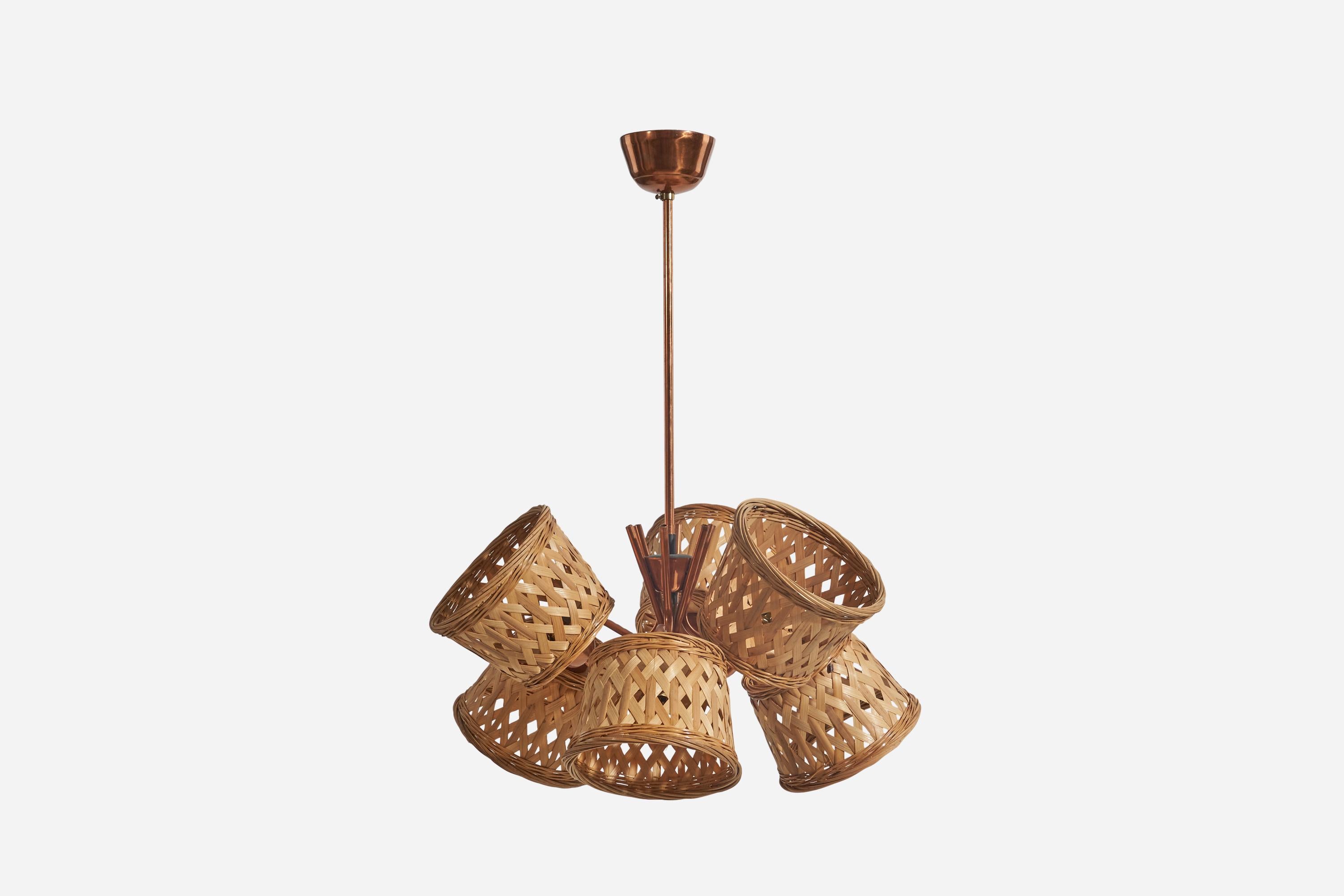 A copper and rattan chandelier designed and produced by a Swedish designer, Sweden, 1950s.

