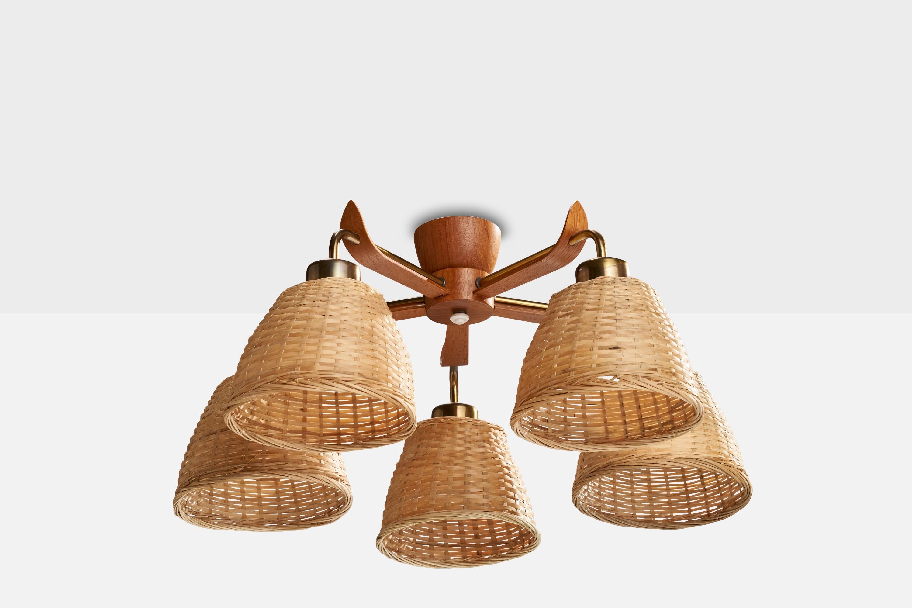 A teak, brass and rattan chandelier designed and produced in Sweden, c. 1950s.

Dimensions of canopy (inches): 3.5” H x 2.08” Diameter
Socket takes standard E-26 bulbs. 5 socket.There is no maximum wattage stated on the fixture. All lighting will be