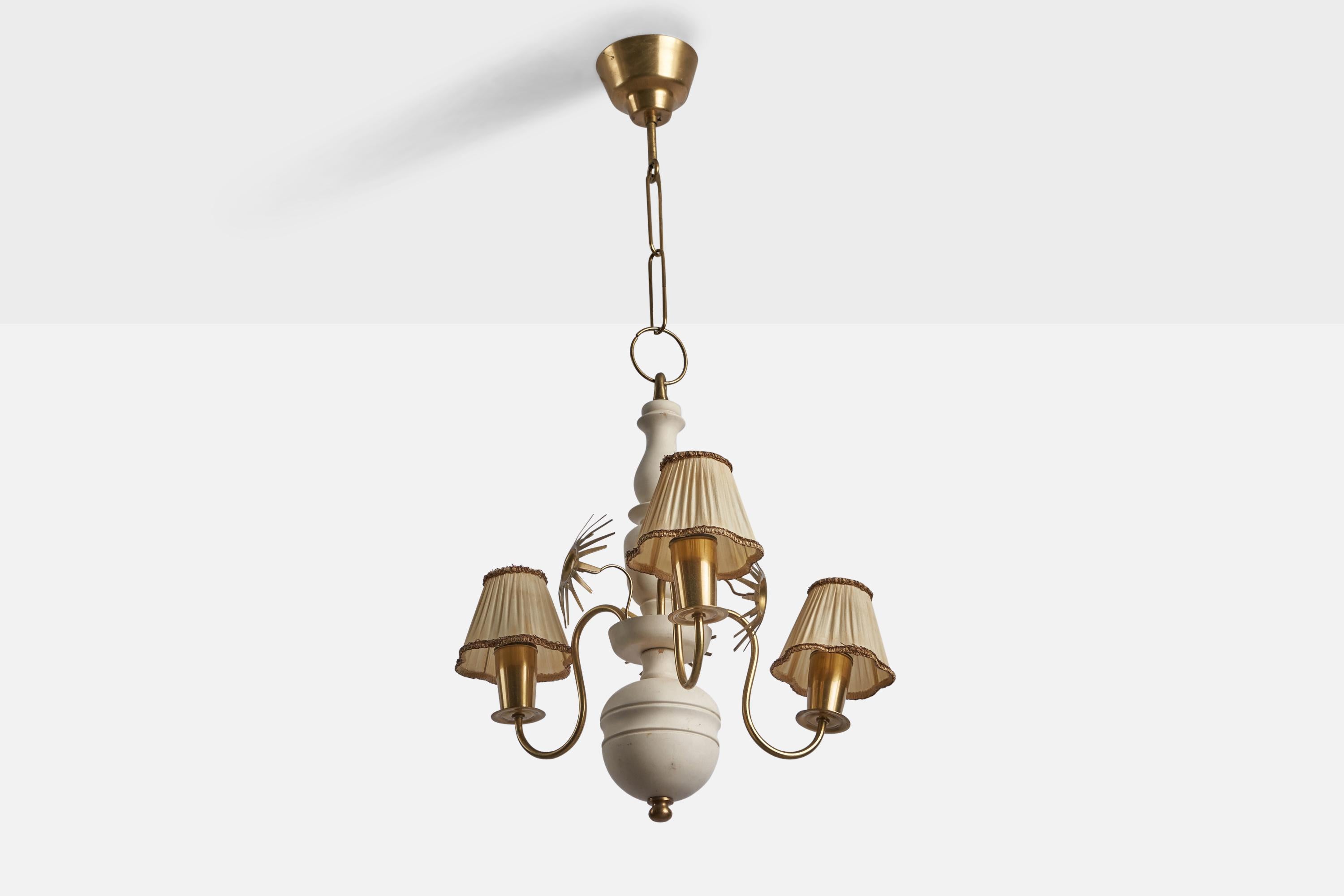 A brass, white-painted wood and fabric chandelier designed and produced in Sweden, 1940s.

Overall Dimensions (inches): 34” H x 17” Diameter
Bulb Specifications: E-26 Bulb
Number of Sockets: 3