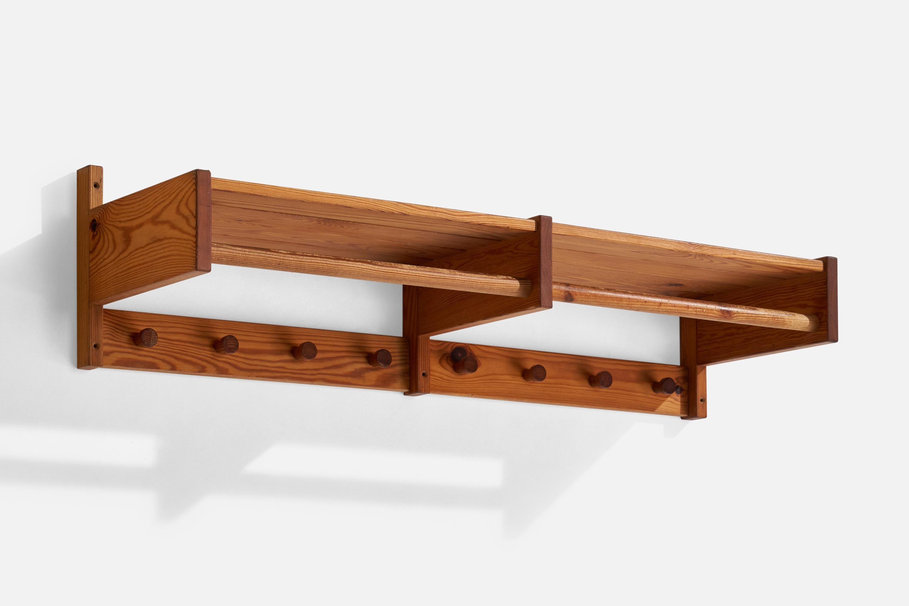 A pine coat rack designed and produced in Sweden, 1970s.