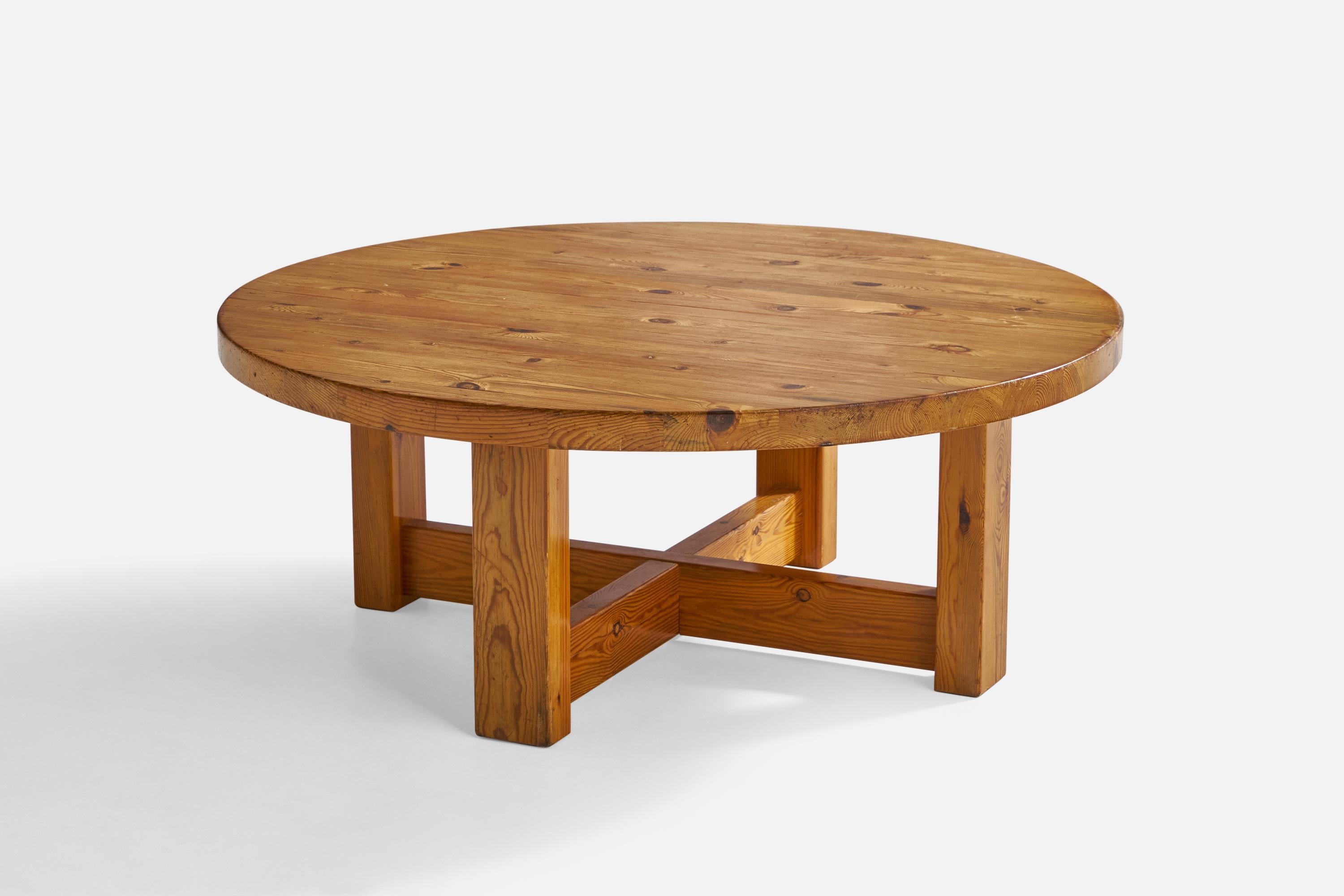 A round pine coffee table designed and produced in Sweden, c. 1960s.