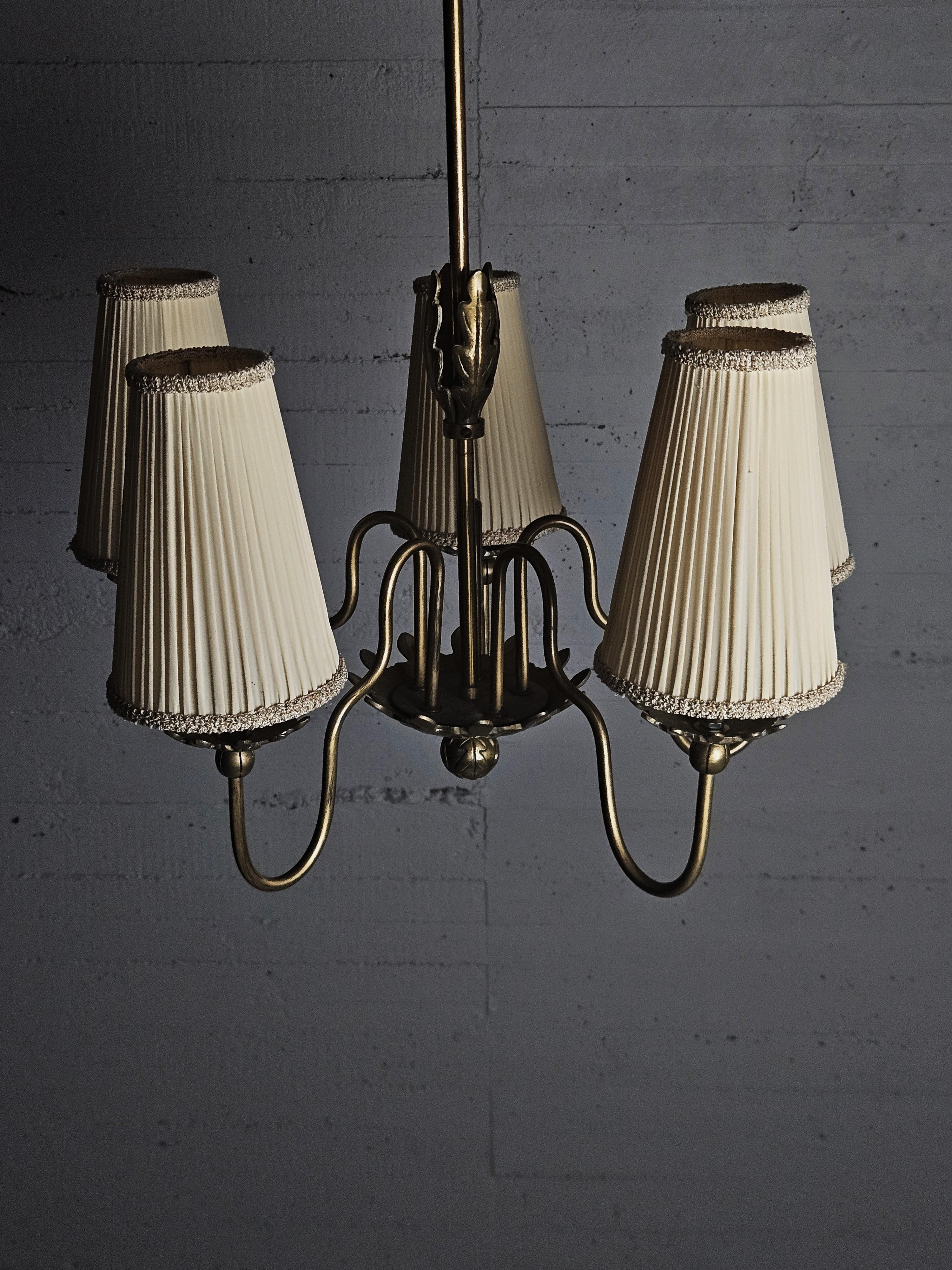 Elegant five armed ceiling lamp made by unknown designer in Sweden during the 1930s. 

Made in brass with great details, a beautiful Swedish grace design. 