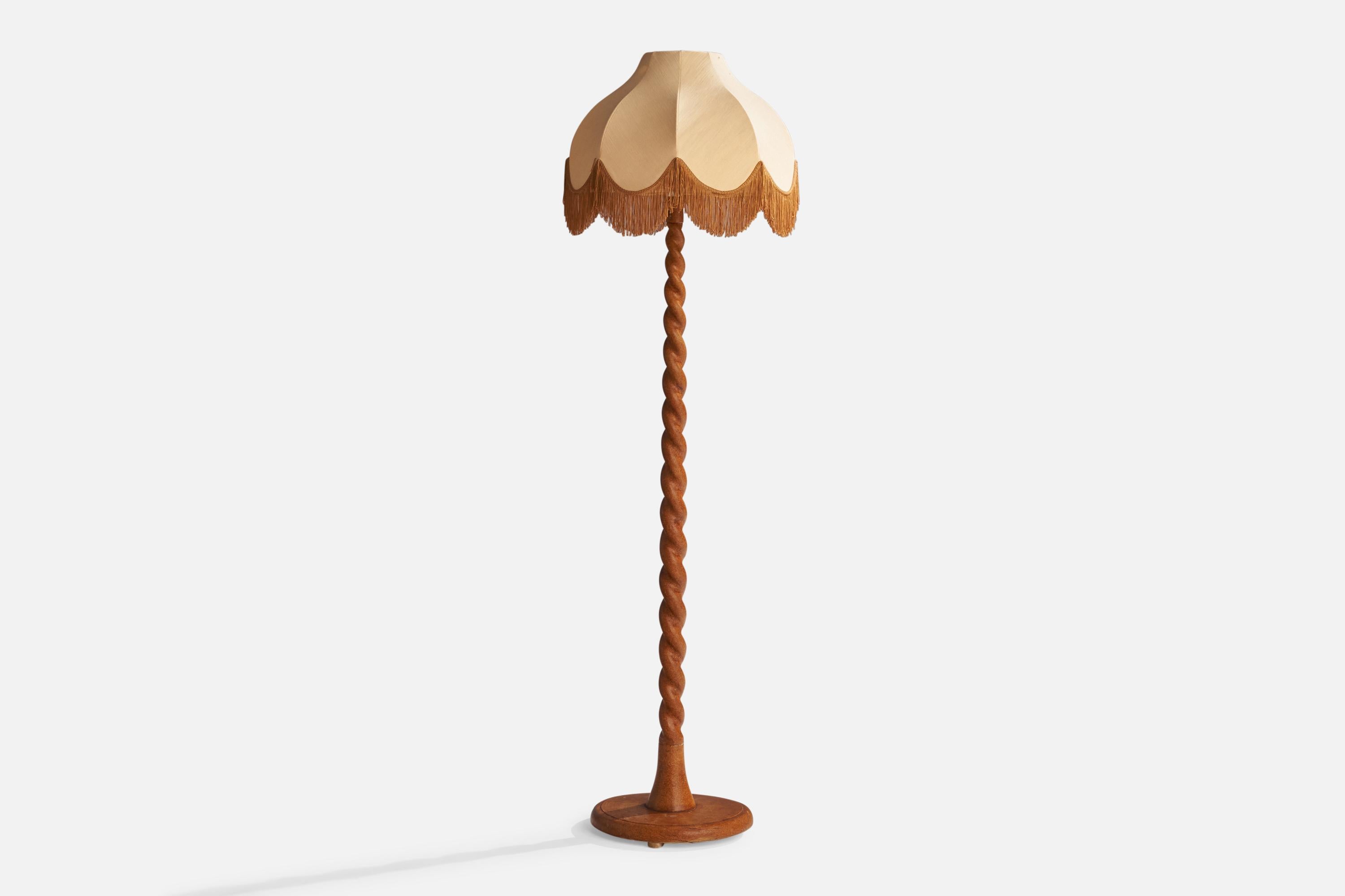 A birch and beige fabric floor lamp designed and produced in Sweden, c. 1920s.

Overall Dimensions (inches): 67”  H x 18”  W x 20” D
Stated dimensions include shade.
Bulb Specifications: E-26 Bulb
Number of Sockets: 1
All lighting will be converted