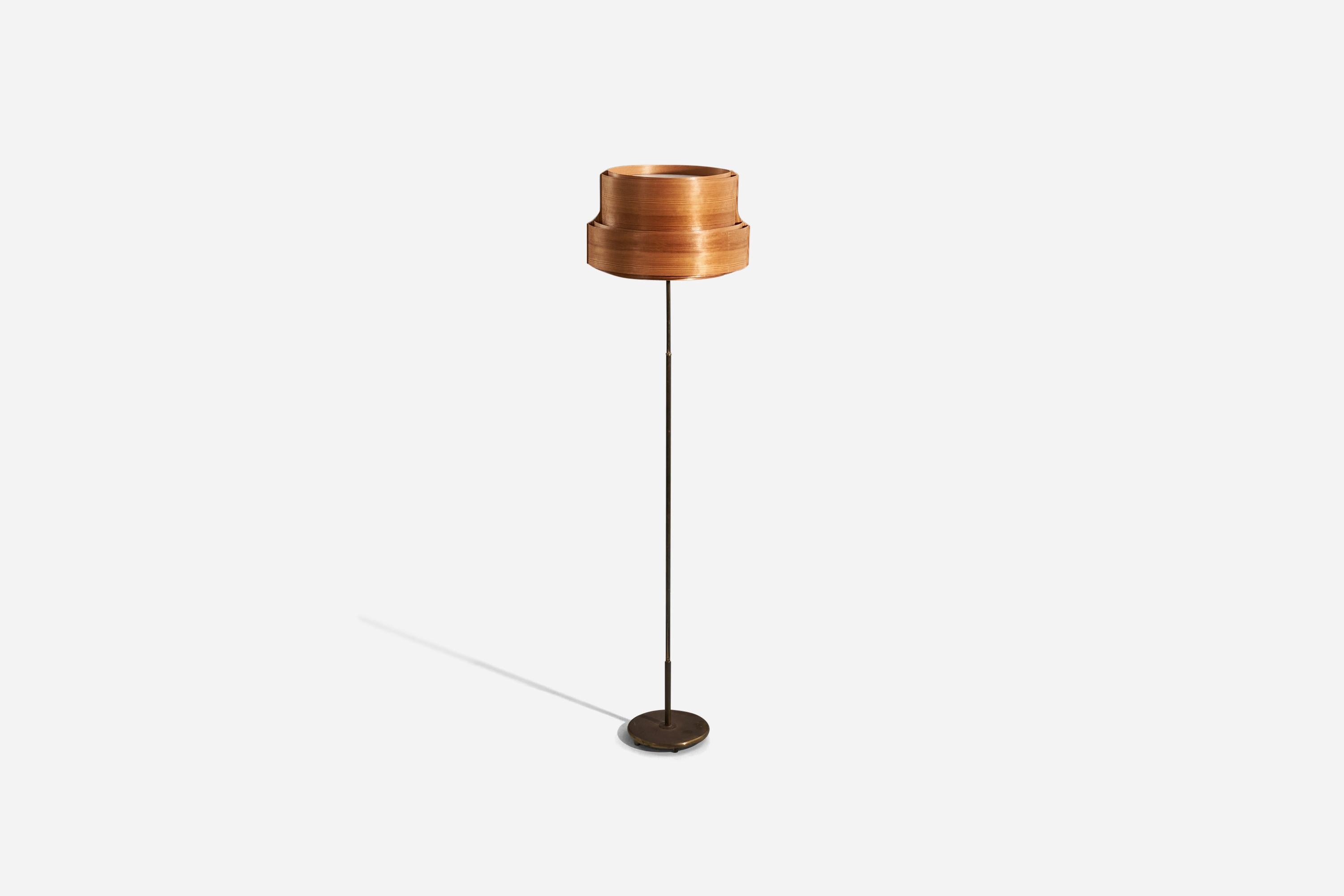 A brass, acrylic, pine and moulded pine veneer floor lamp designed and produced in Sweden, 1960s.

Sold with lampshade. 
Dimensions stated refer to the floor lamp with the lampshade.