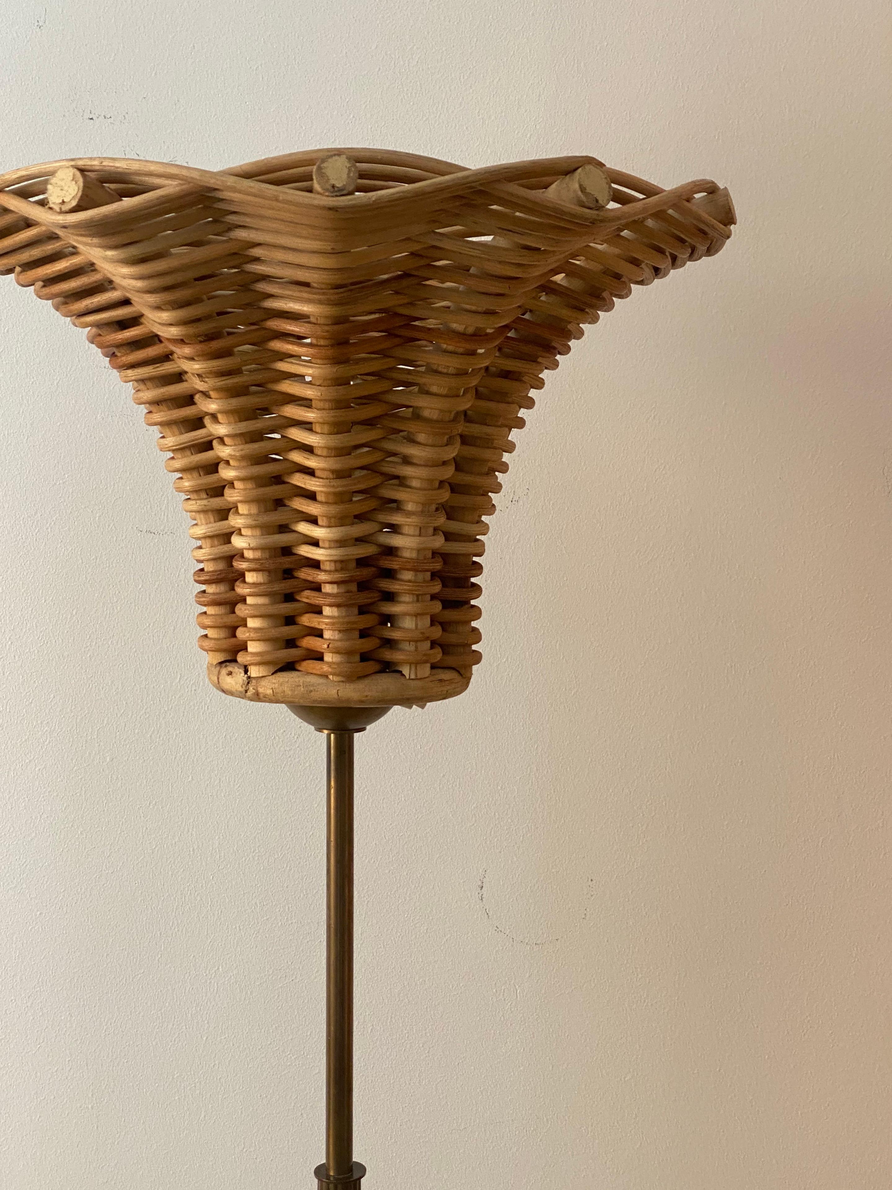A floor lamp. By unknown Swedish designer, 1950s. Brass rod and base. Assorted vintage lampshade in bamboo and rattan.

Other designers of the period include Hans-Agne Jakobsson, Paavo Tynell, Josef Frank, Hans Bergström, and Alvar Aalto.
